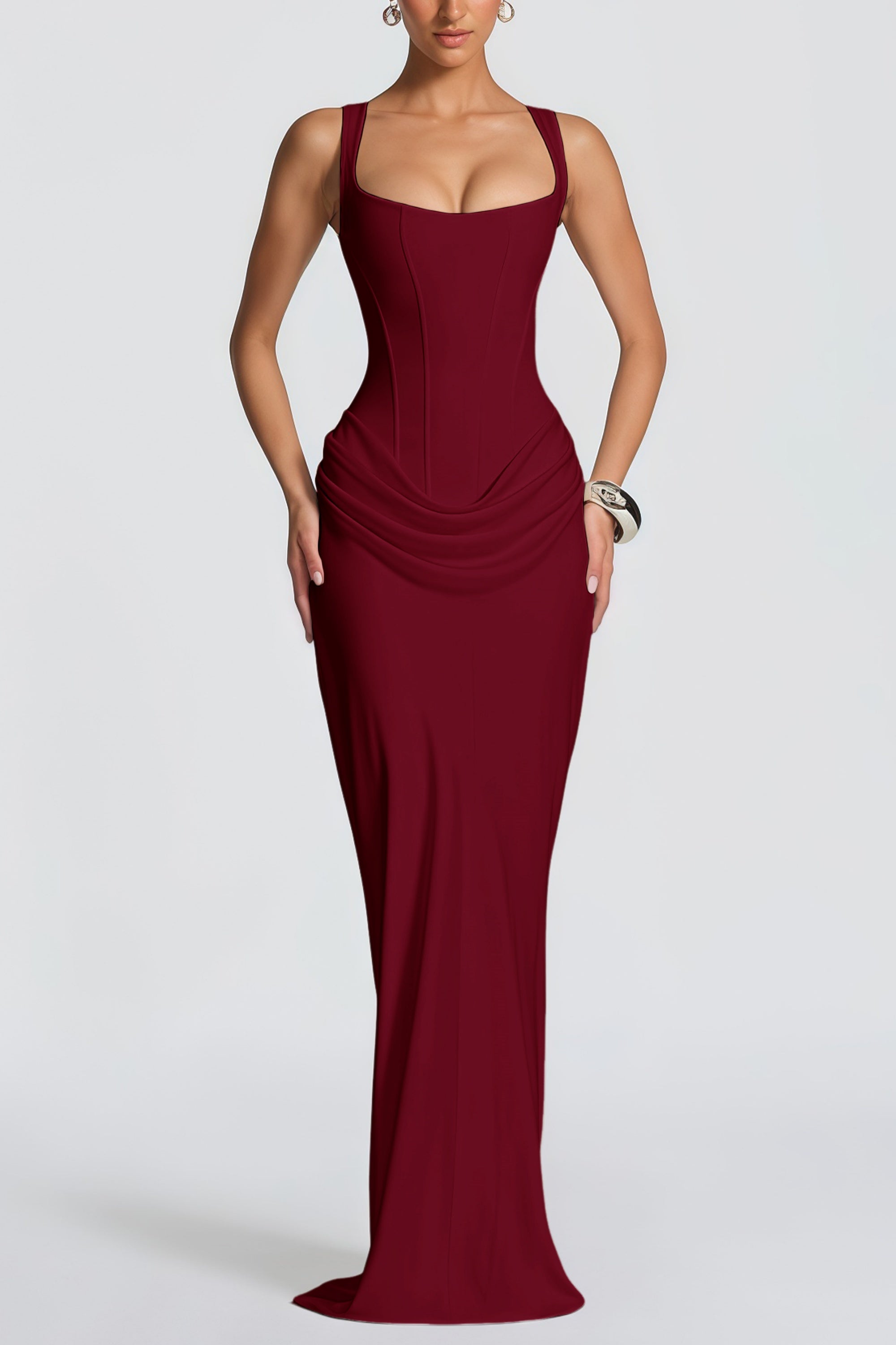 Burgundy floor-length gown with a corset-style bodice and draped hip detail