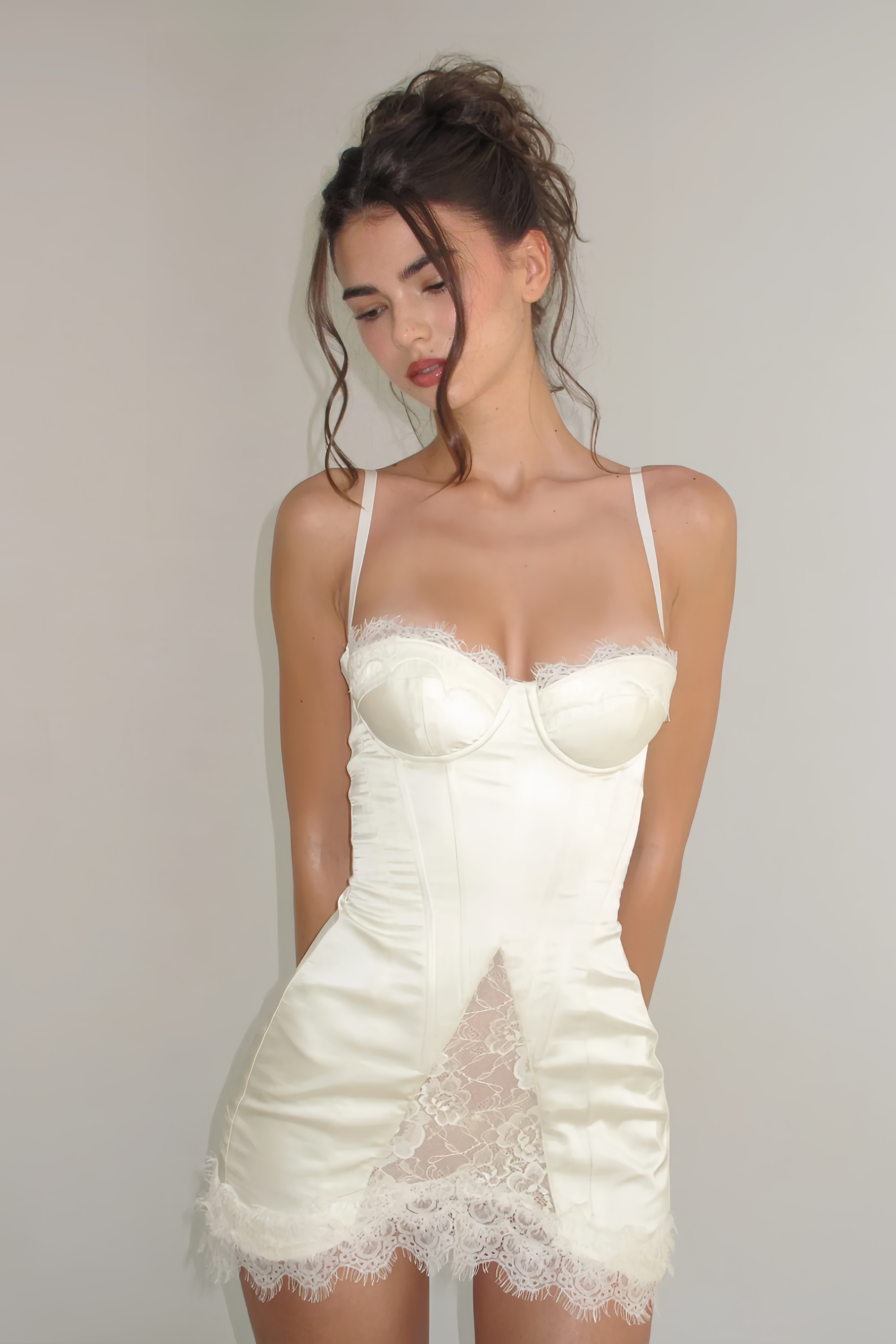 White satin corset mini dress with lace inserts and trim