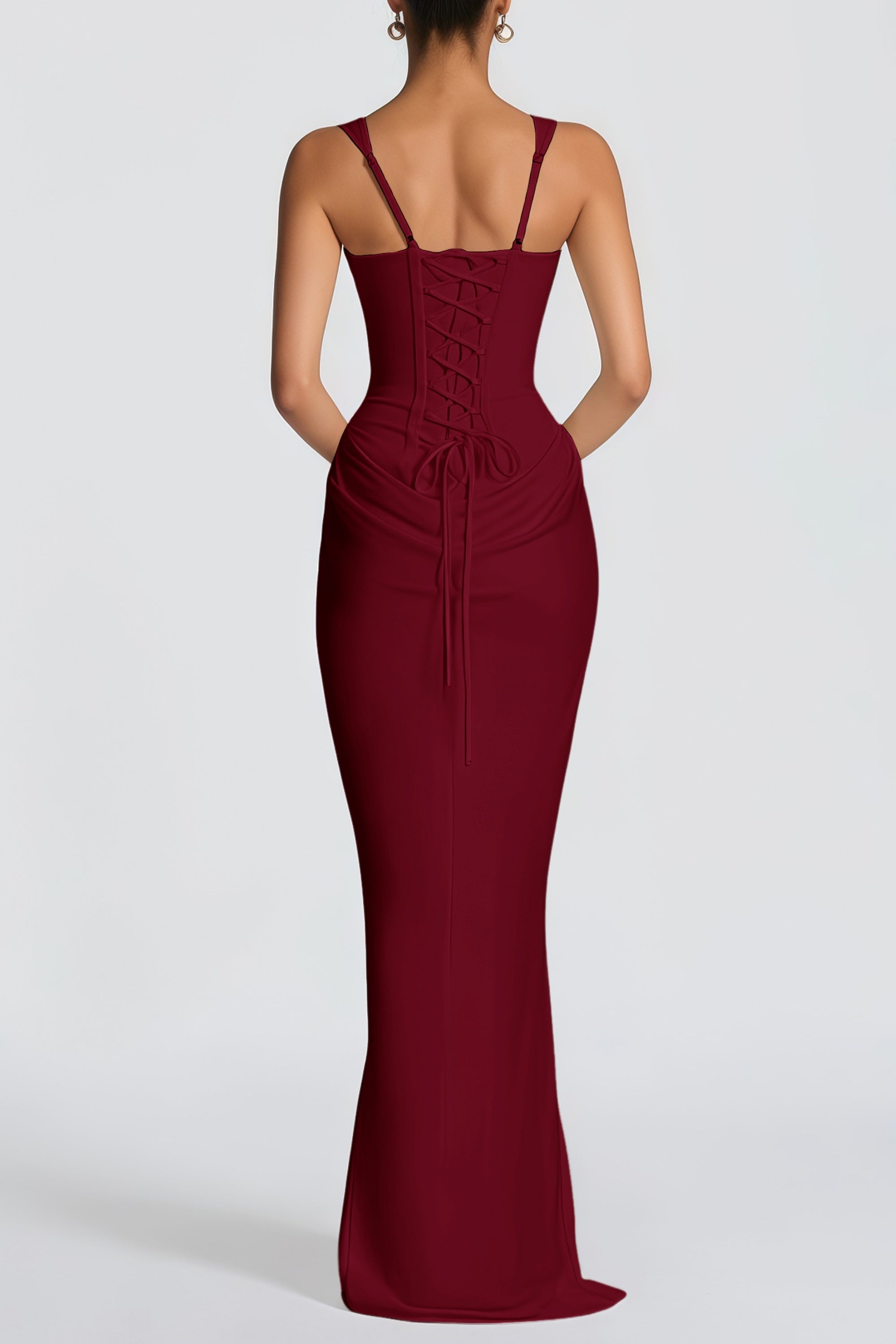 Burgundy floor-length gown with a corset-style bodice and draped hip detail
