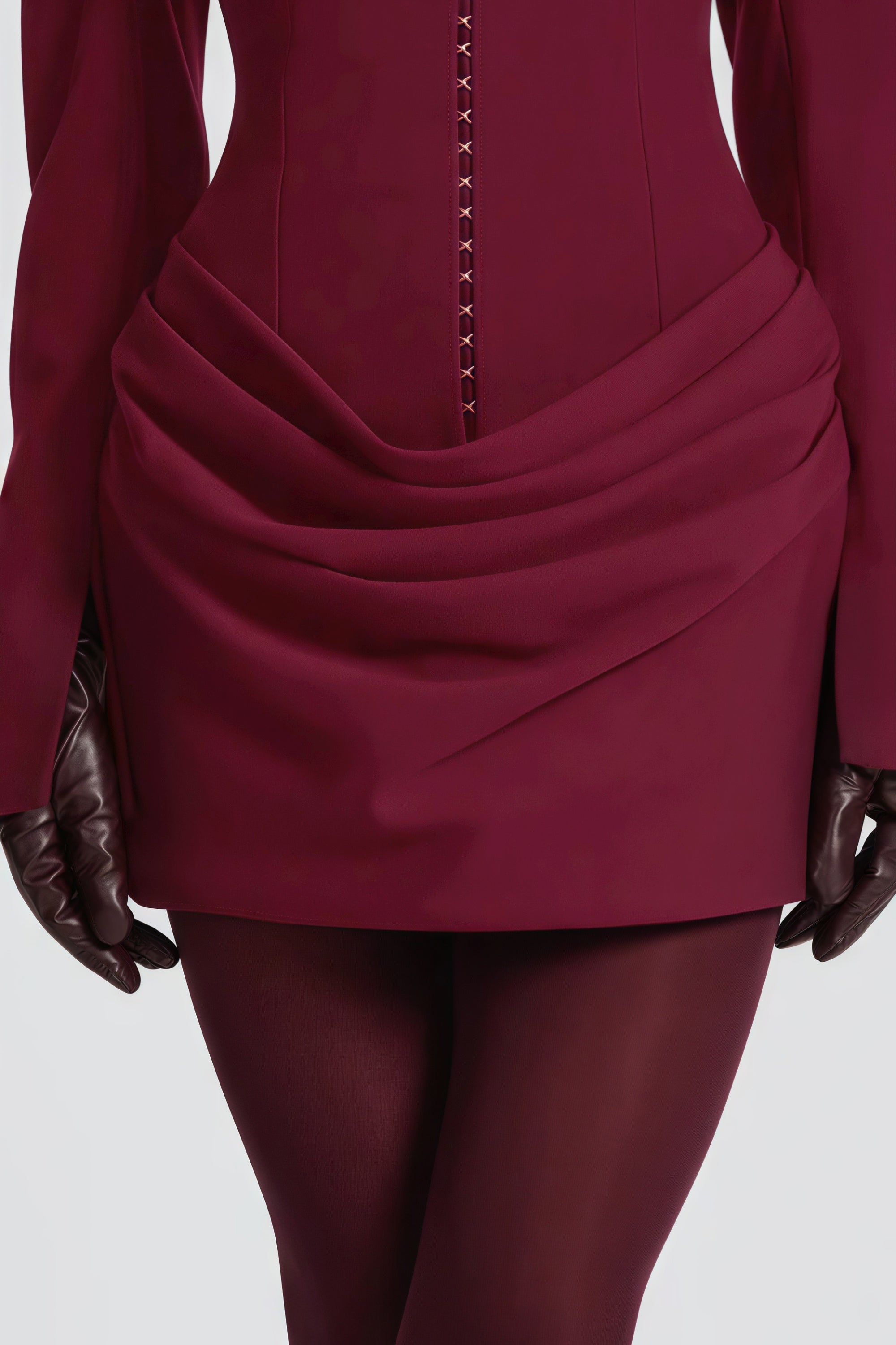 Burgundy long-sleeve blazer mini dress with a draped skirt