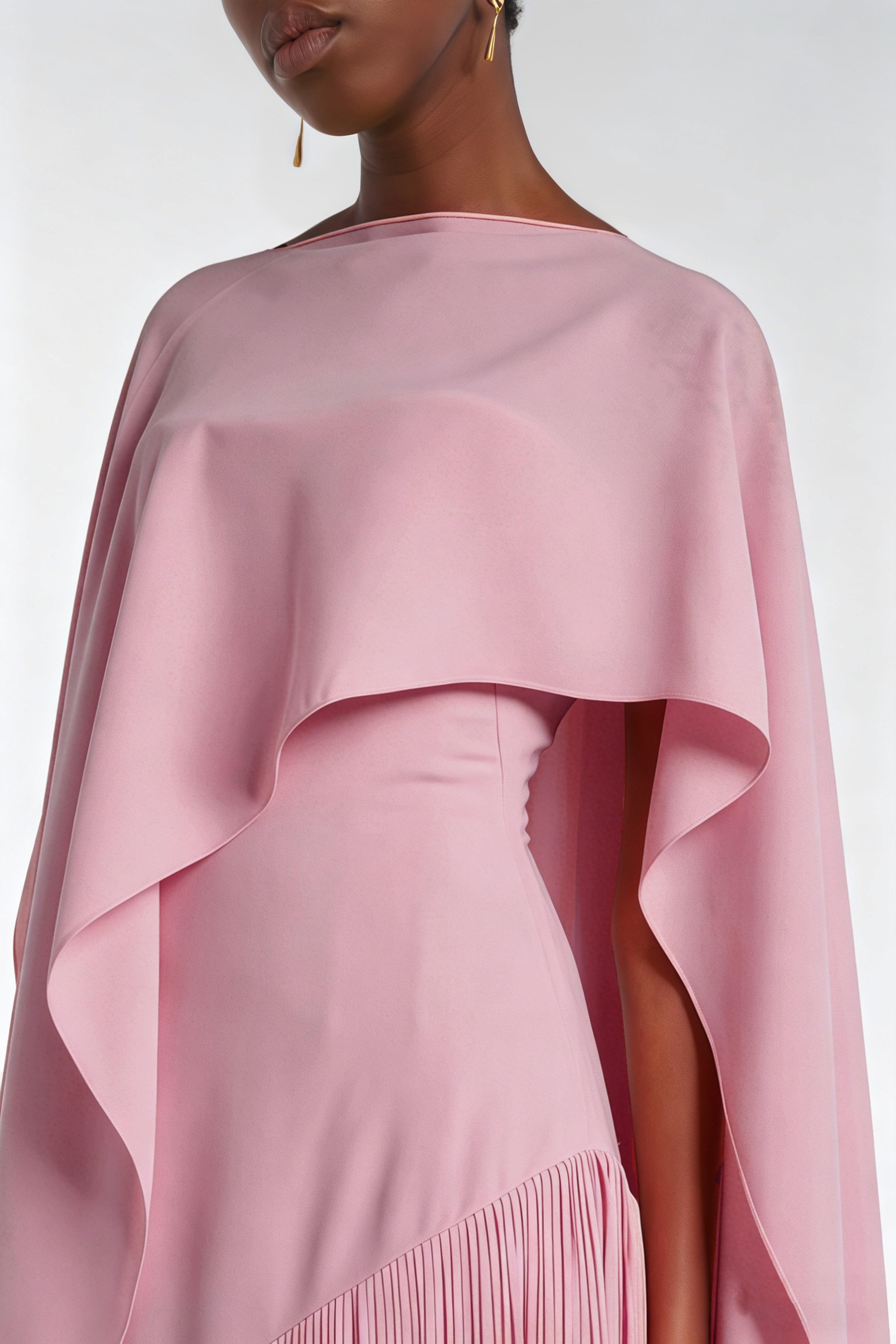 Mauve pink cape-style gown with a long fringed skirt