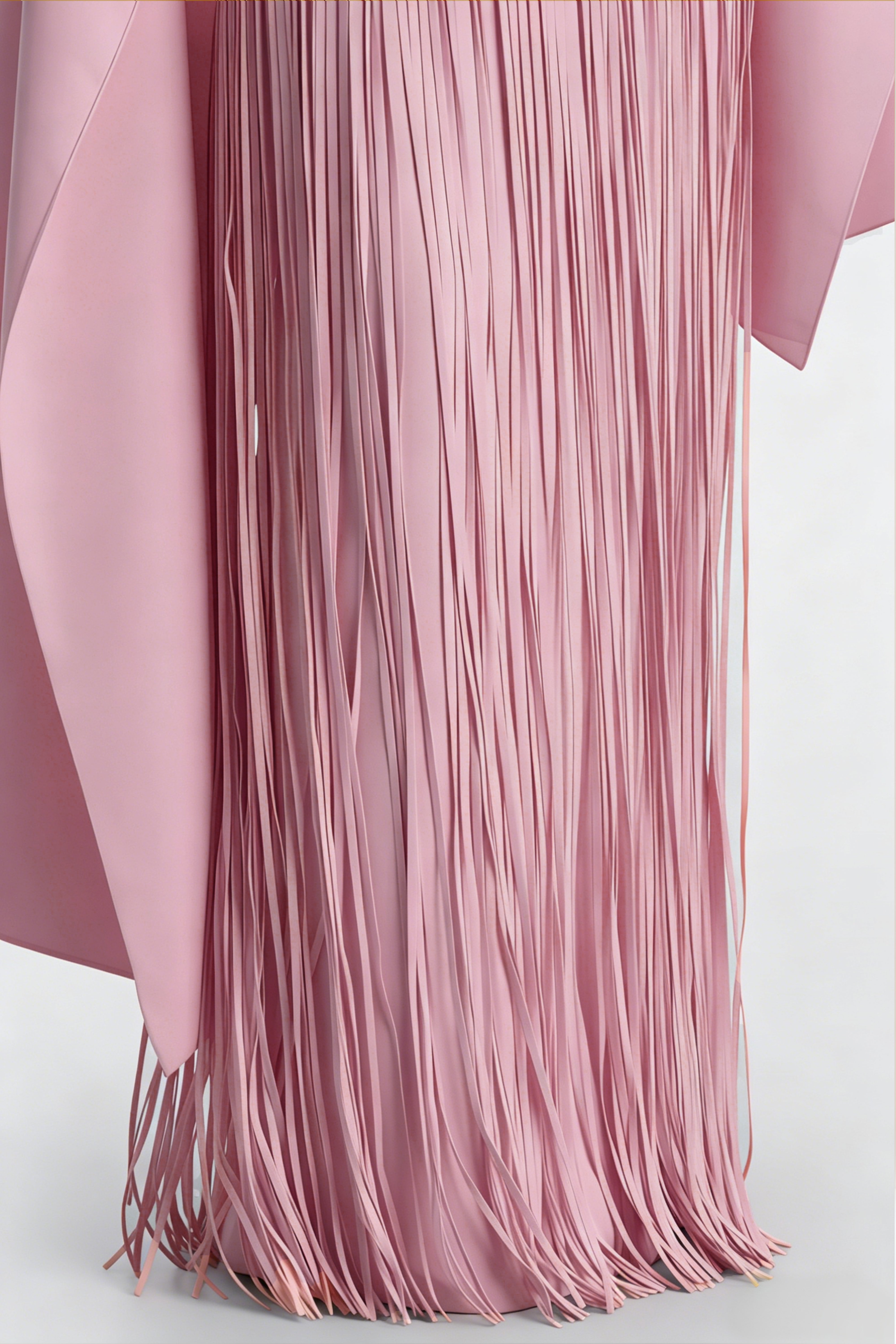 Mauve pink cape-style gown with a long fringed skirt