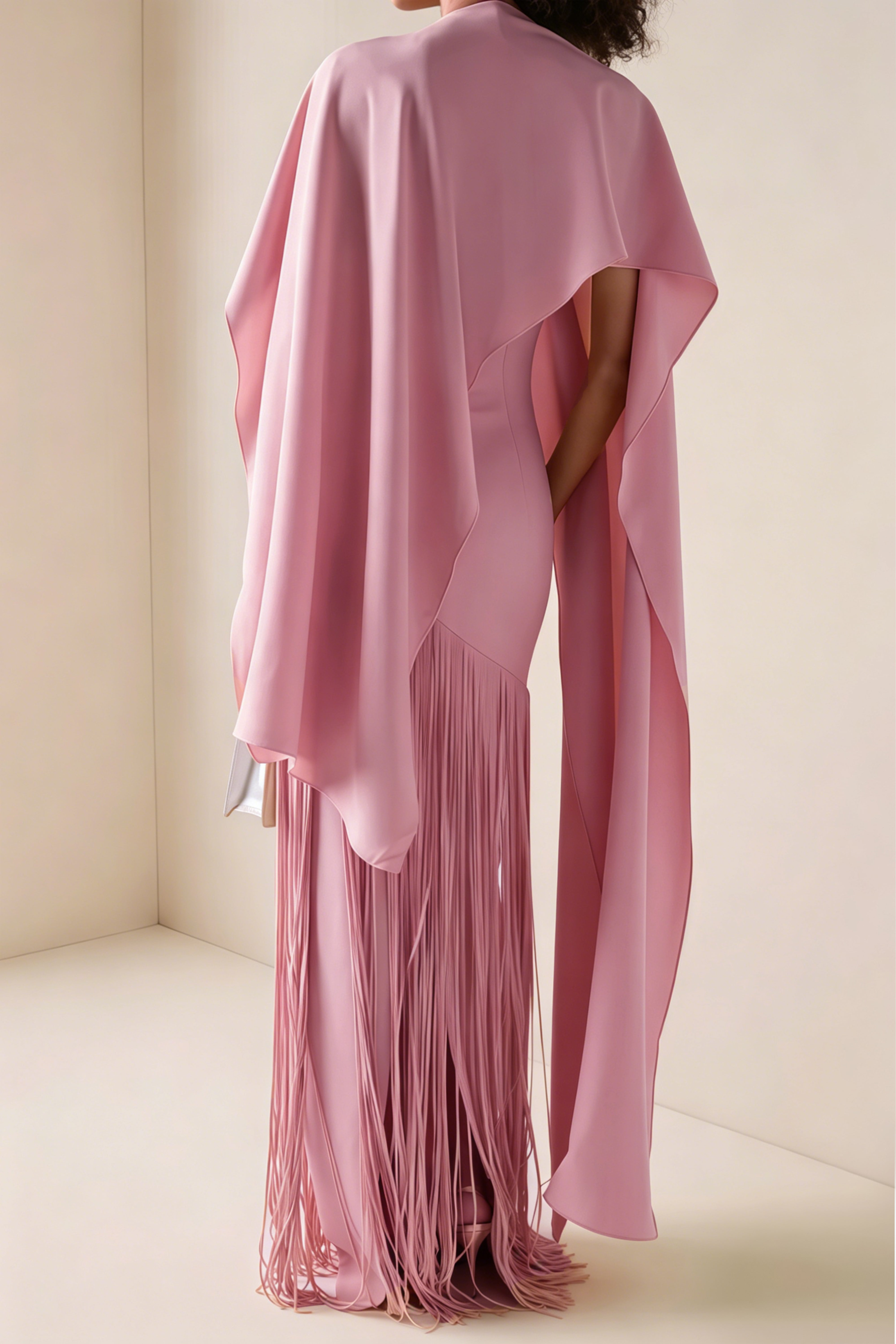 Mauve pink cape-style gown with a long fringed skirt