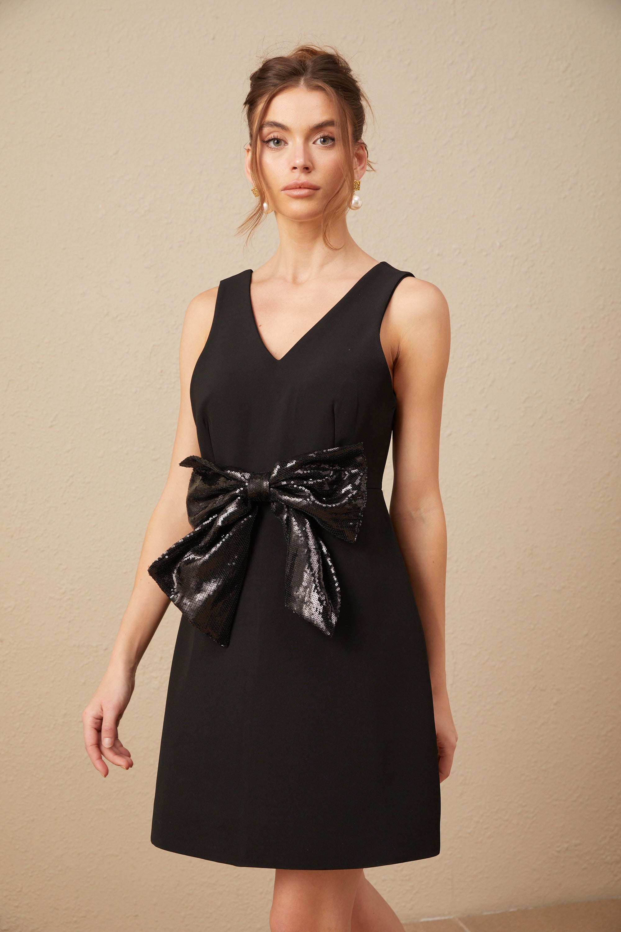 Roxane V-neck sequin-bow mini dress in Black (Final Sale-US Only)