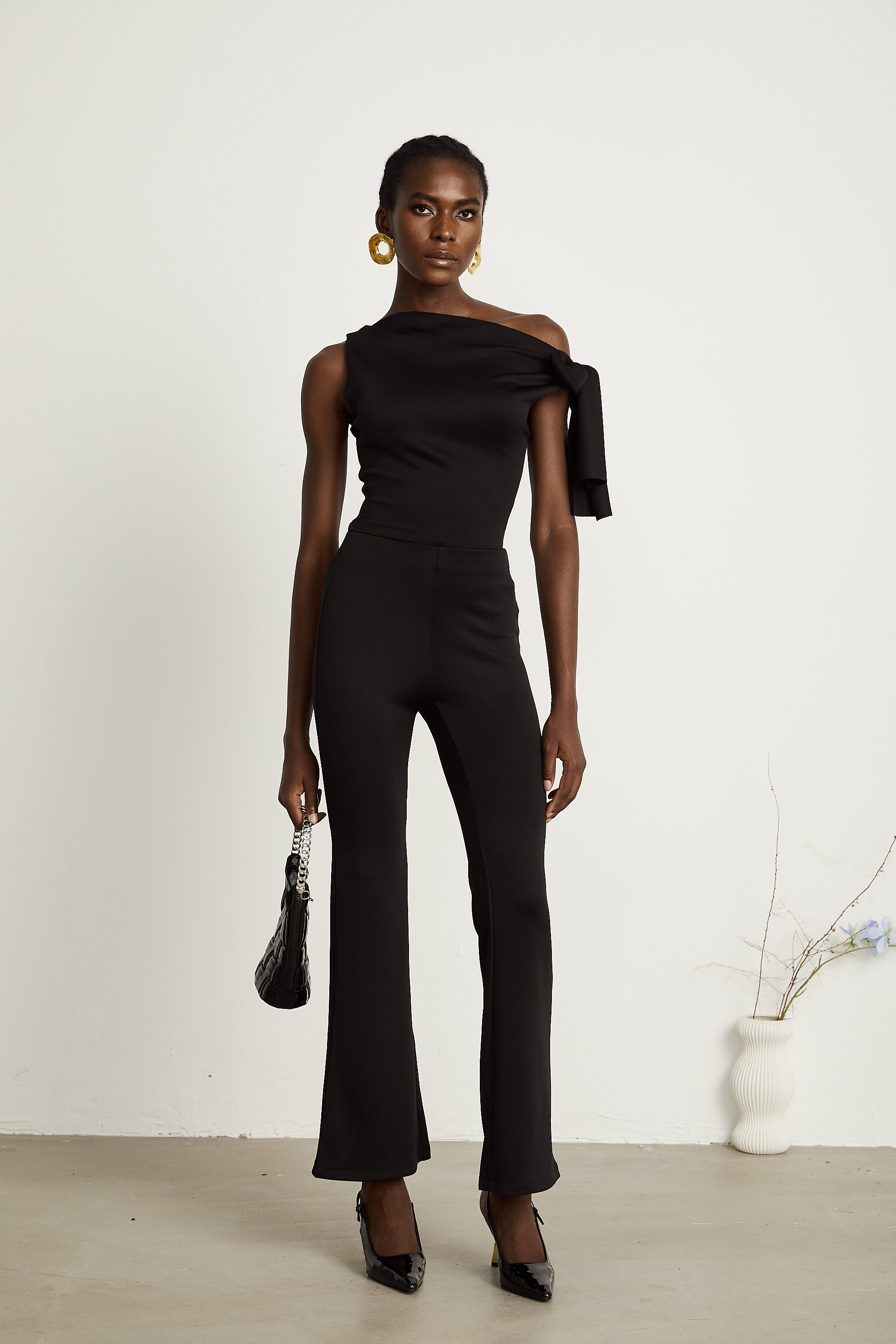 Ensemble coordonné Clotilde : haut et pantalon en maille noire (Vente définitive - États-Unis uniquement)