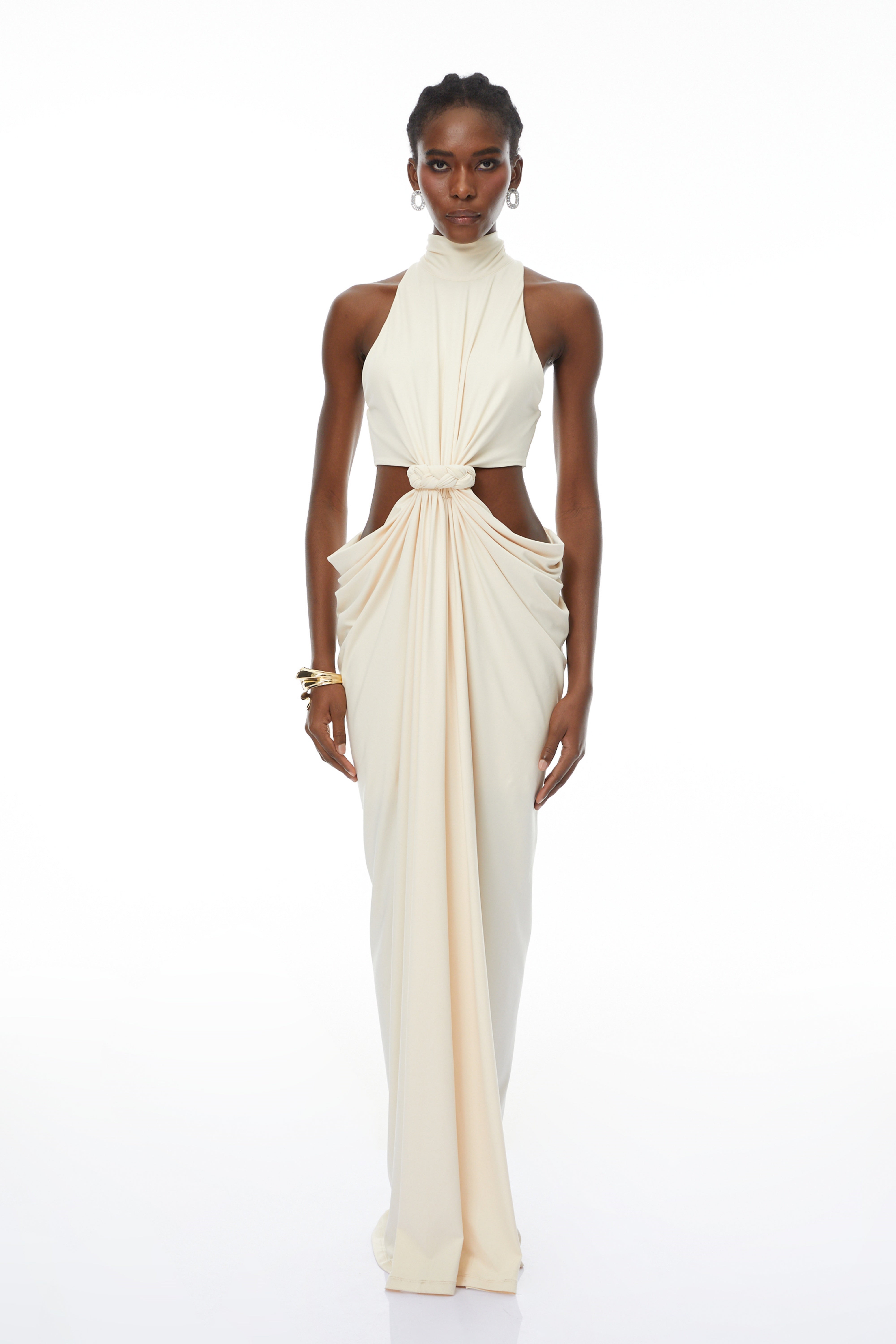 Cream halter maxi dress with waist cutouts and a knotted draped bodice