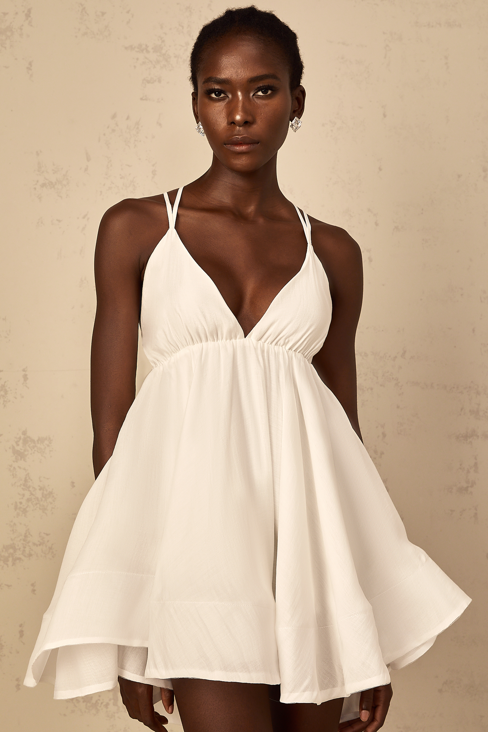 Quincie white shirred flounced mini dress
