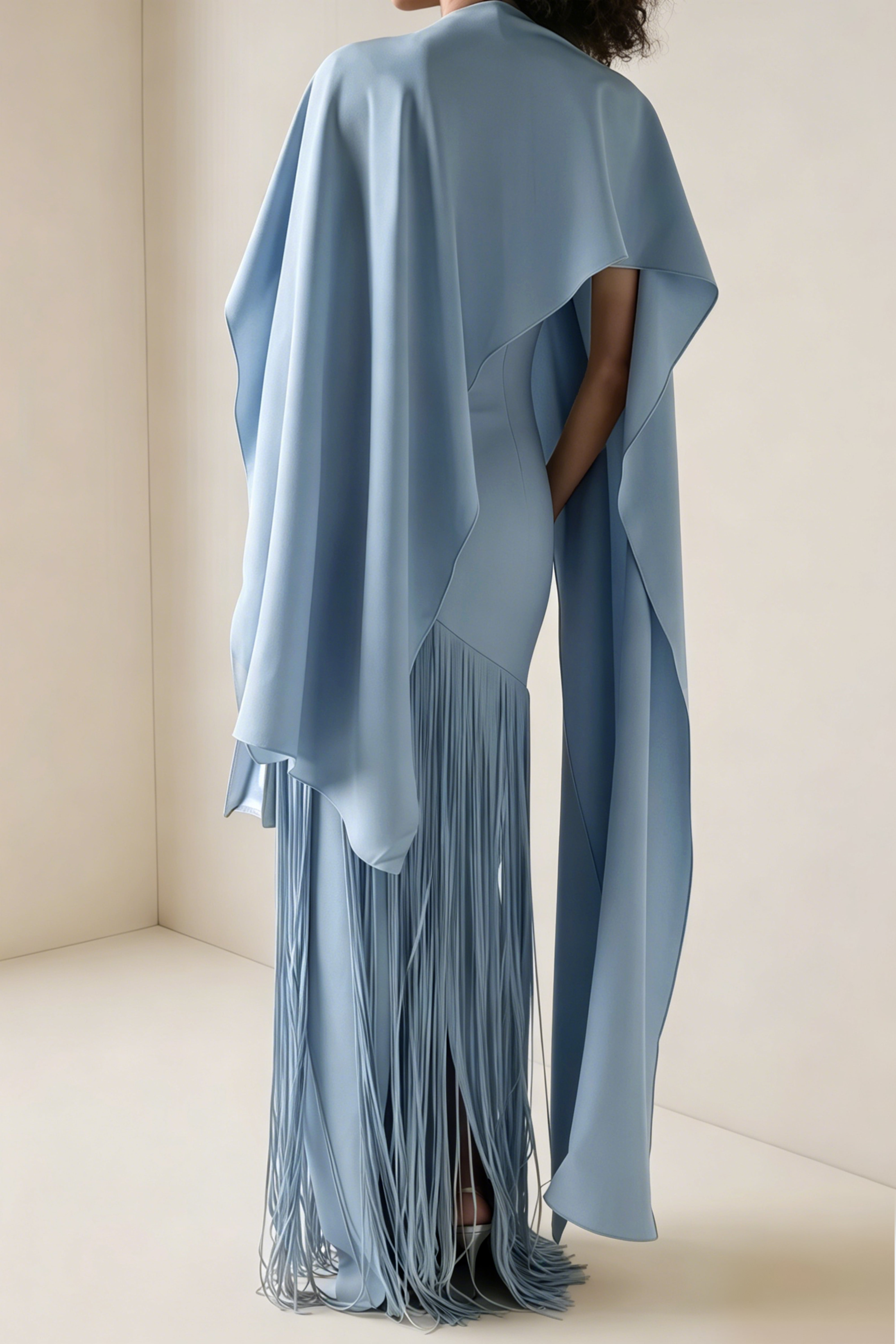 Light blue cape-style gown with a long fringed skirt