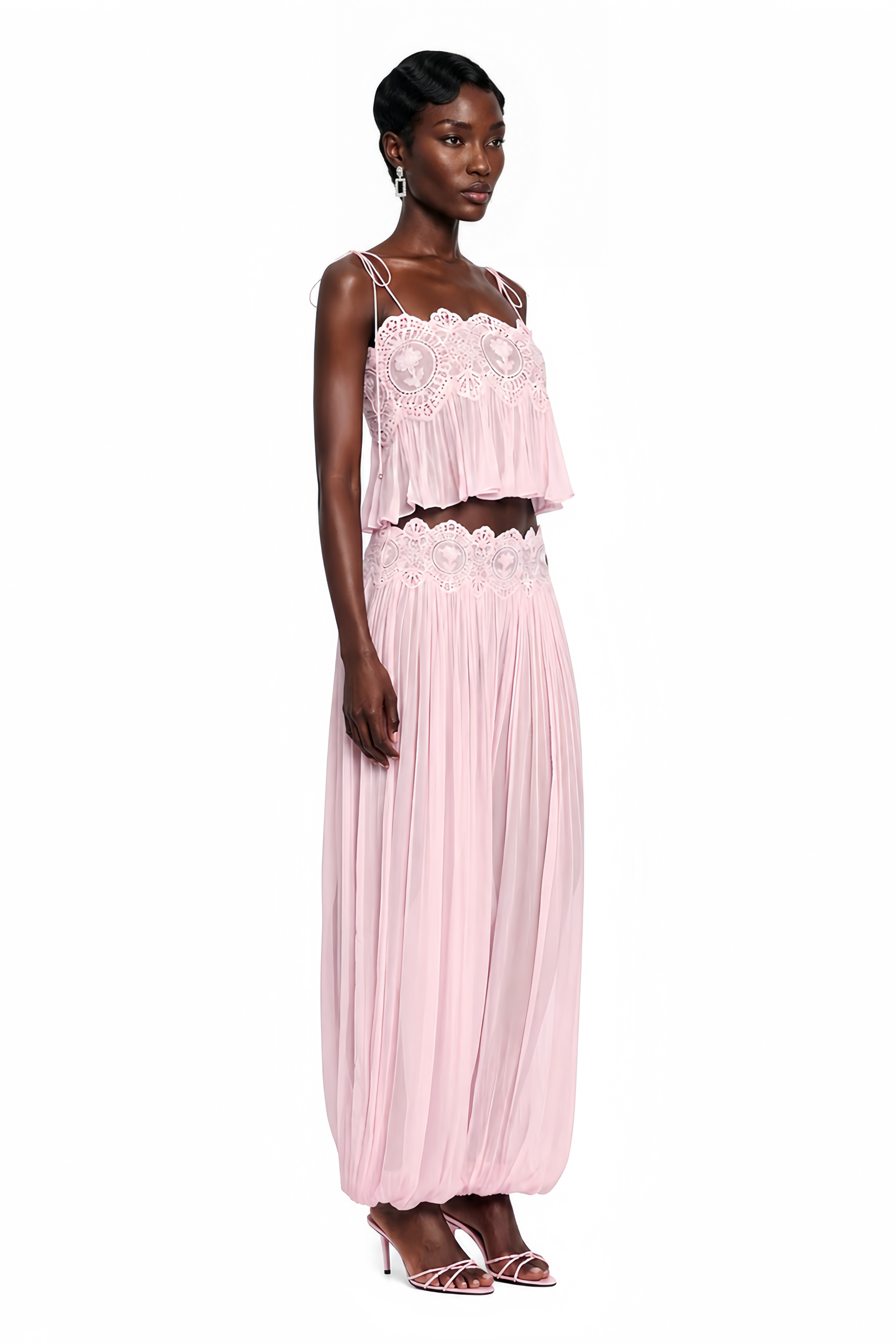 Light pink pleated two-piece set featuring a lace-trimmed camisole crop top and matching wide-leg harem pants