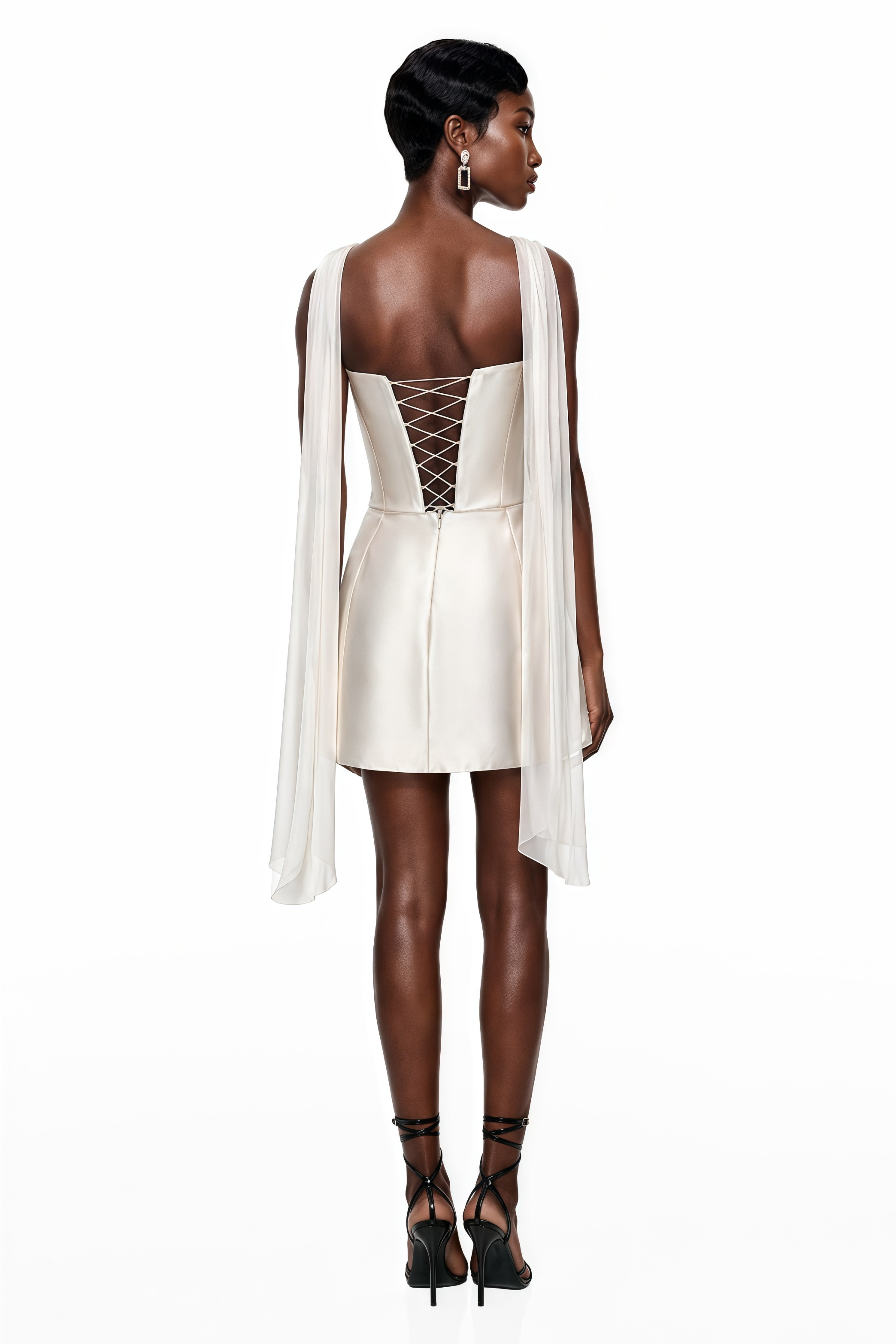 White satin strapless mini dress featuring an elongated corset bodice with intricate bead and pearl embroidery