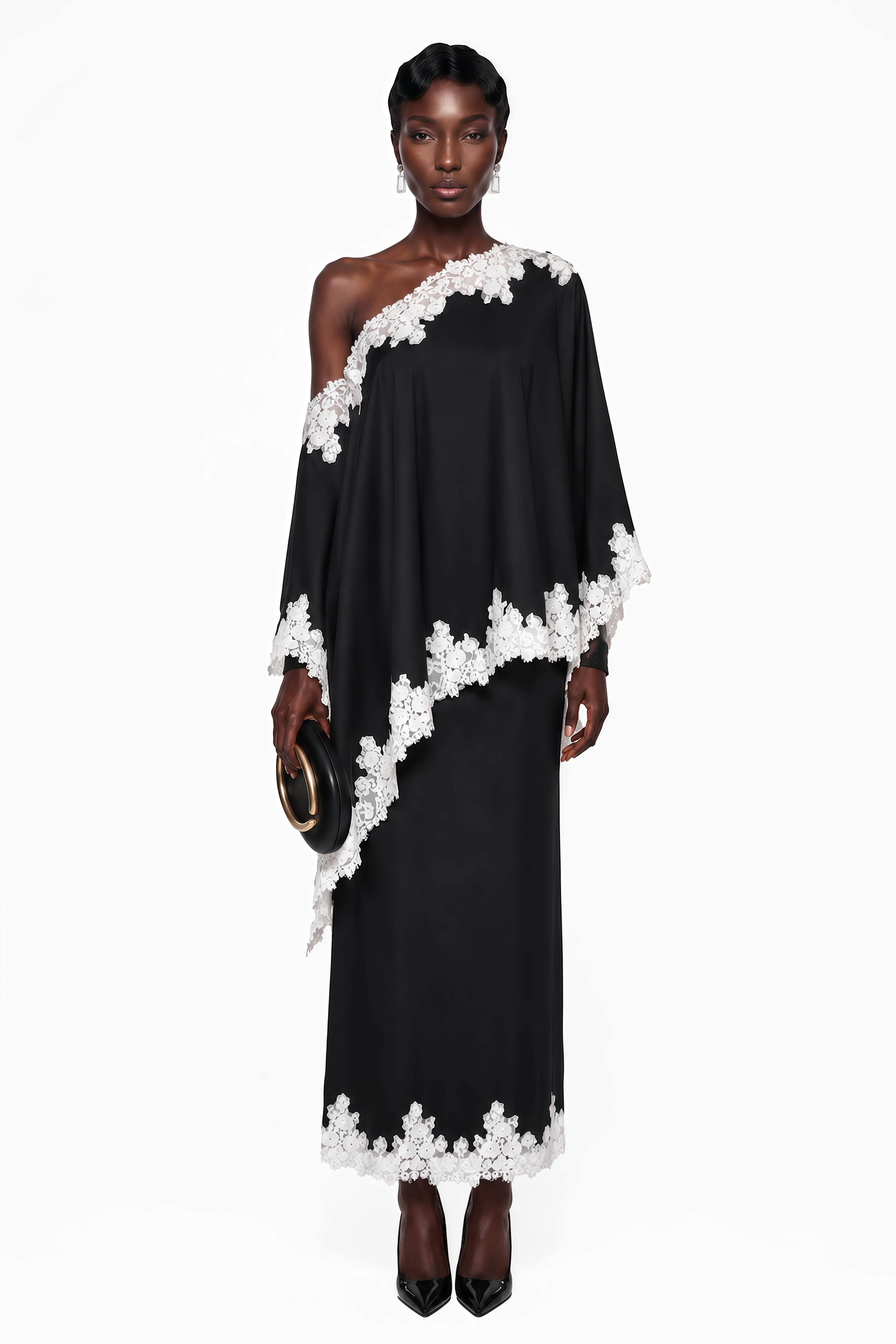 Black one-shoulder maxi dress with an asymmetric lace-trimmed cape and lace-trimmed hem