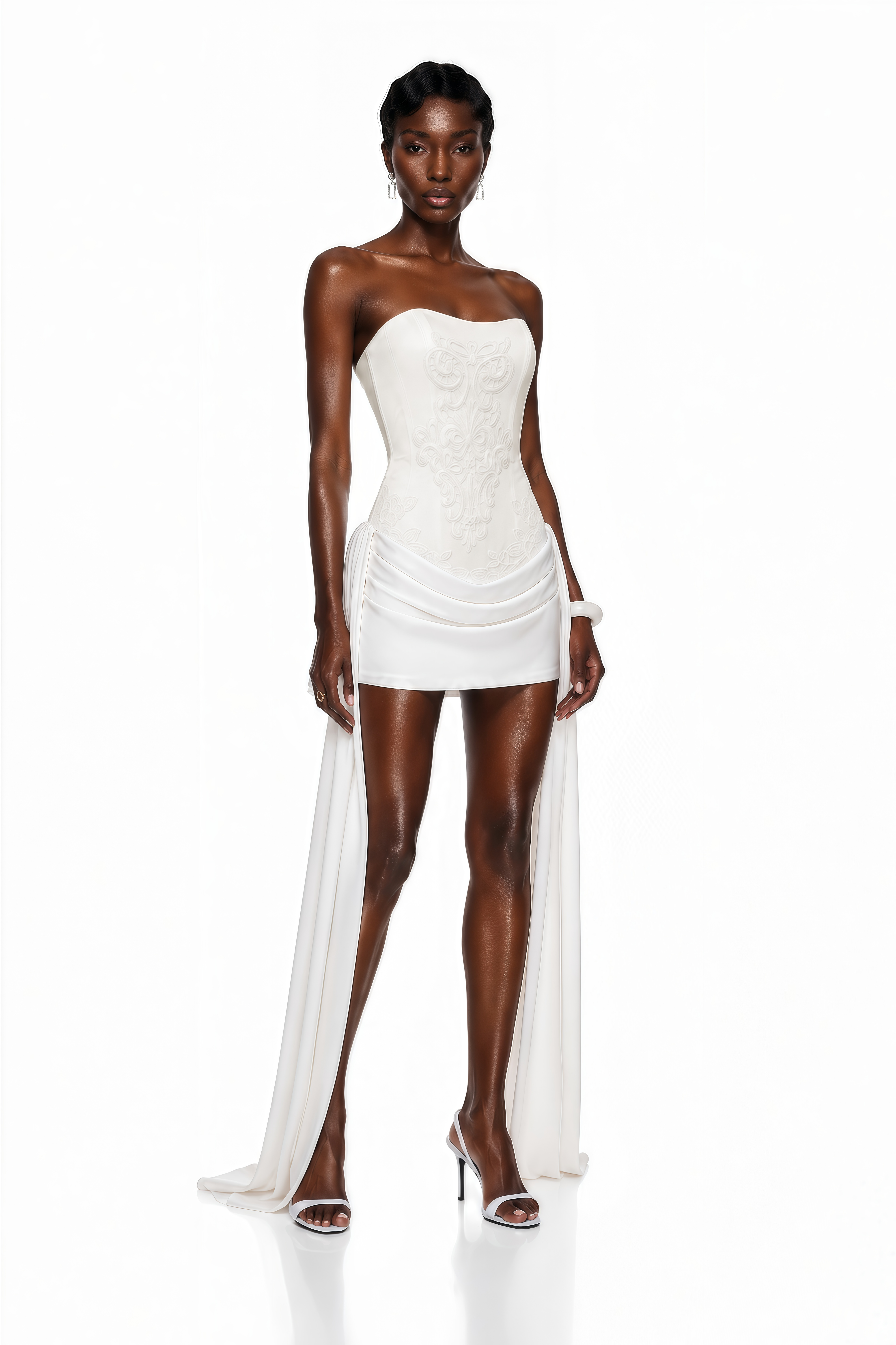 White strapless mini dress with an embroidered bodice and side drapes