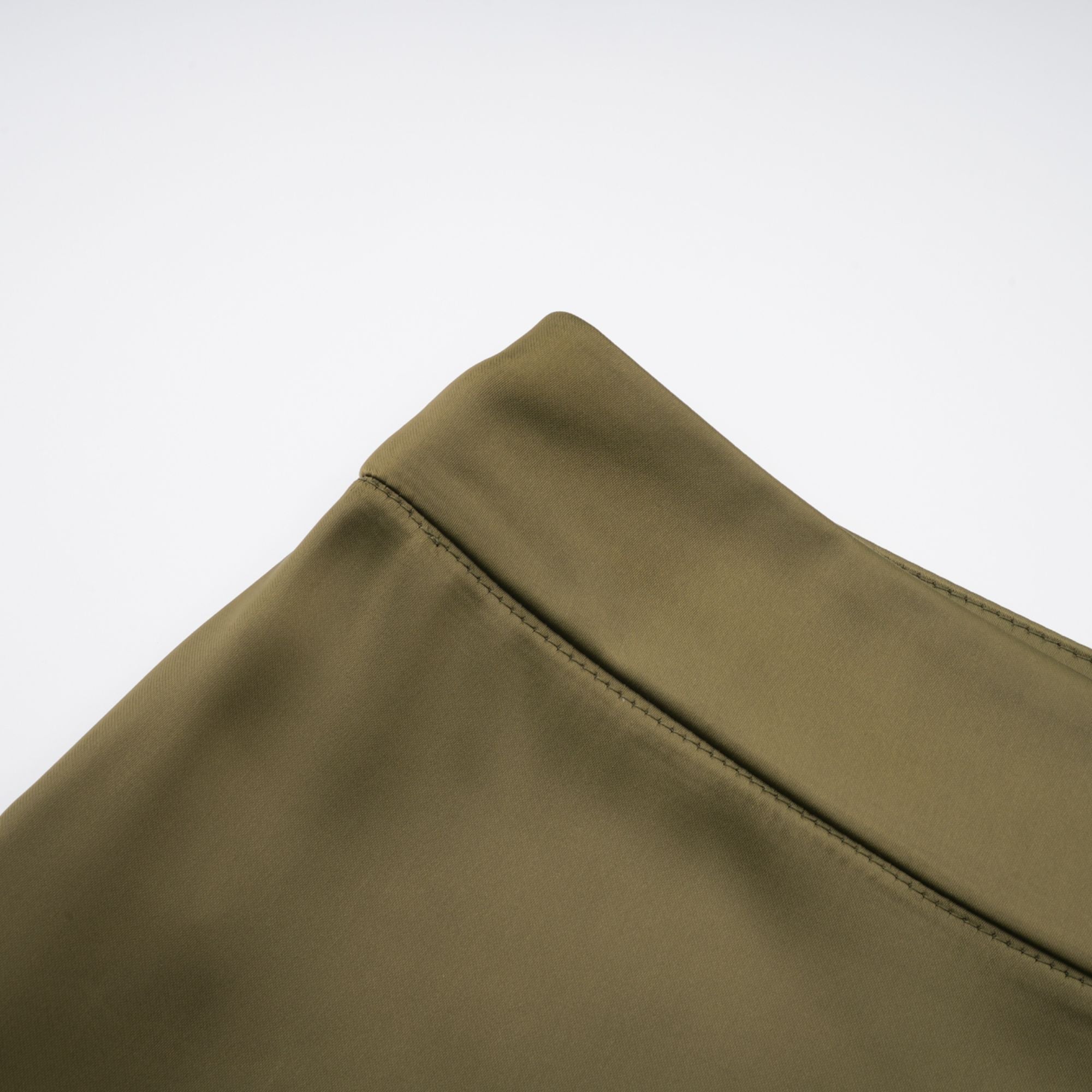 Olive green sleeveless maxi dress with a satin skirt