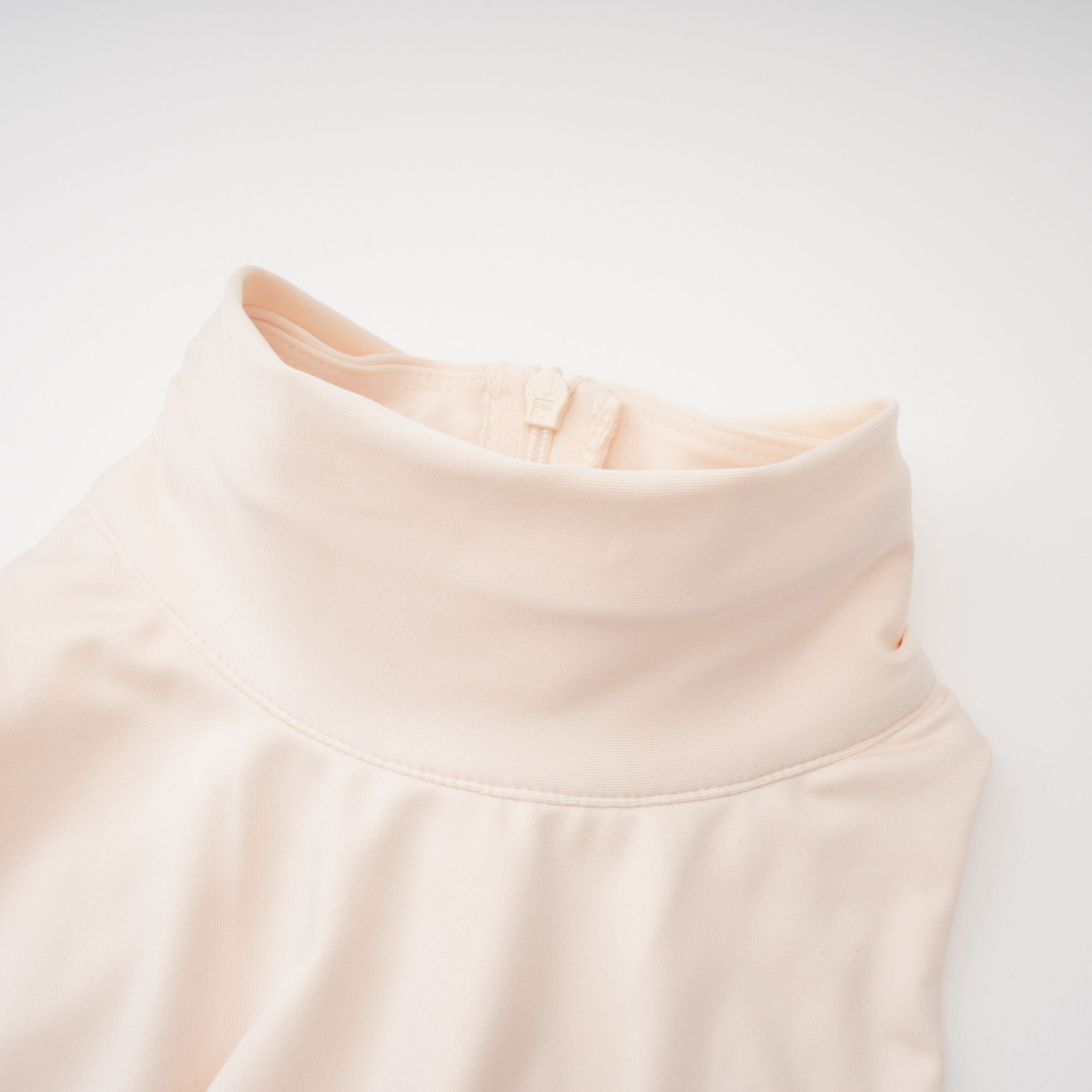 Cream halter maxi dress with waist cutouts and a knotted draped bodice