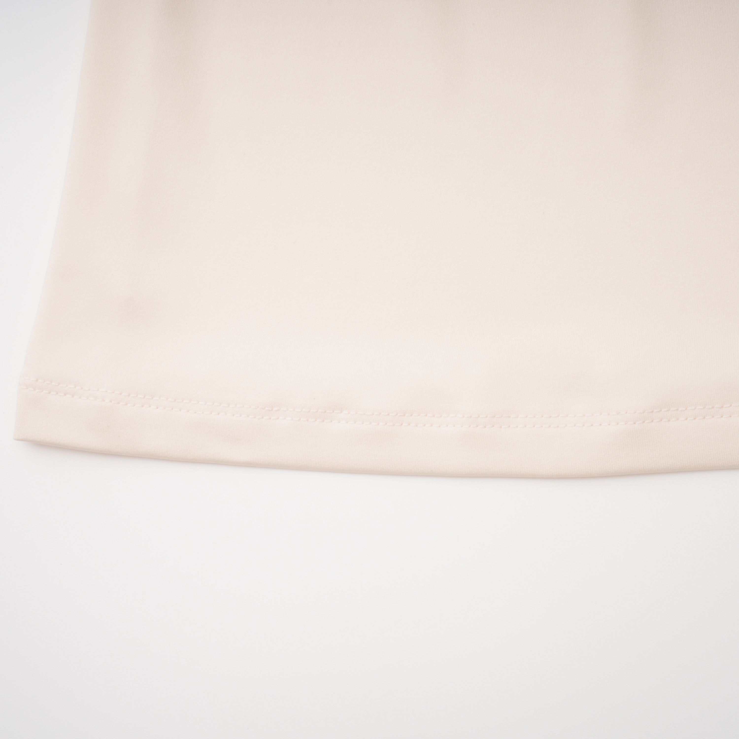 Cream halter maxi dress with waist cutouts and a knotted draped bodice