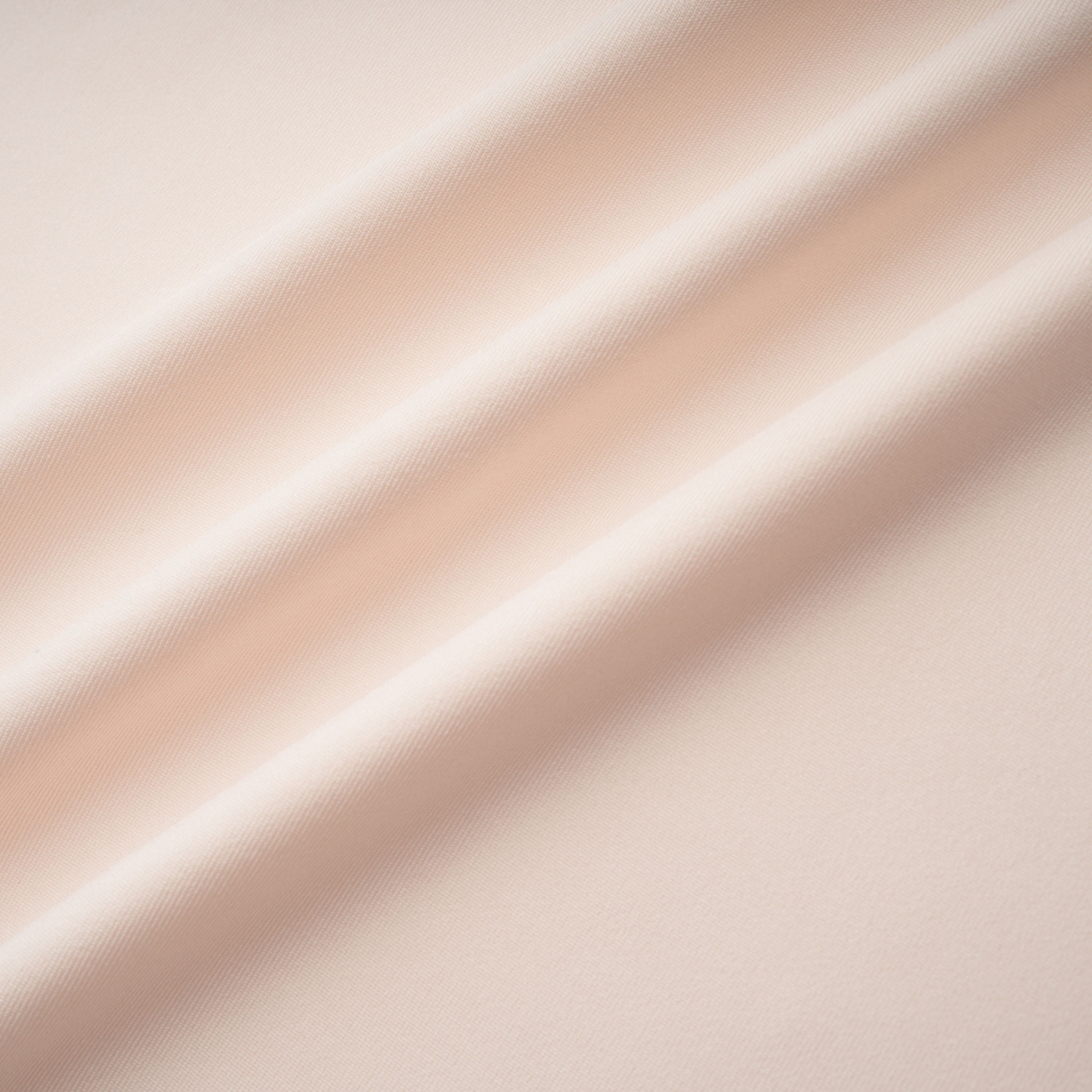 Cream halter maxi dress with waist cutouts and a knotted draped bodice