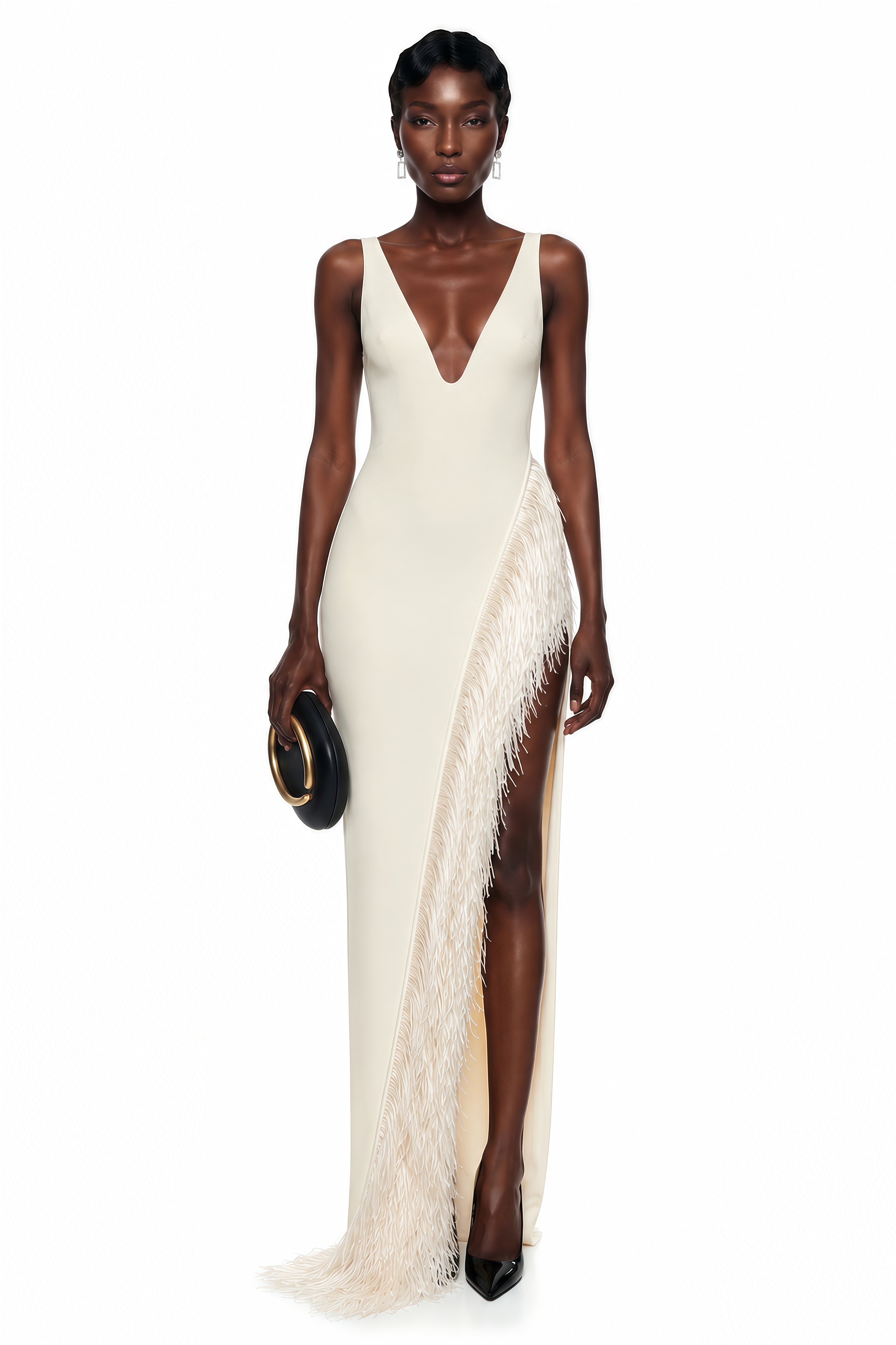 White maxi dress with a plunging V-neckline and a high slit trimmed with fringe
