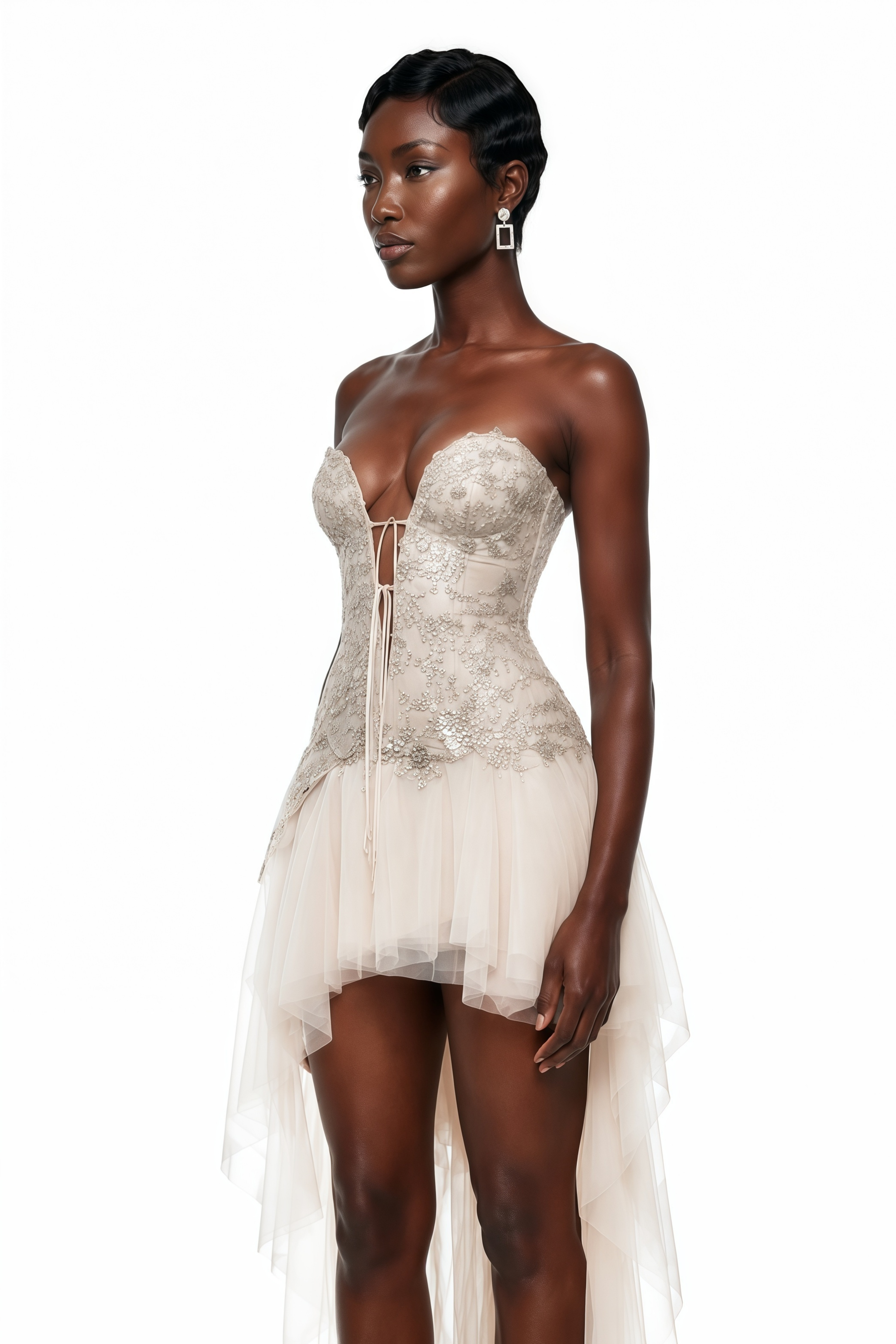 Cream high-low dress featuring an embroidered lace-up corset bodice and a ruffled tulle asymmetric skirt