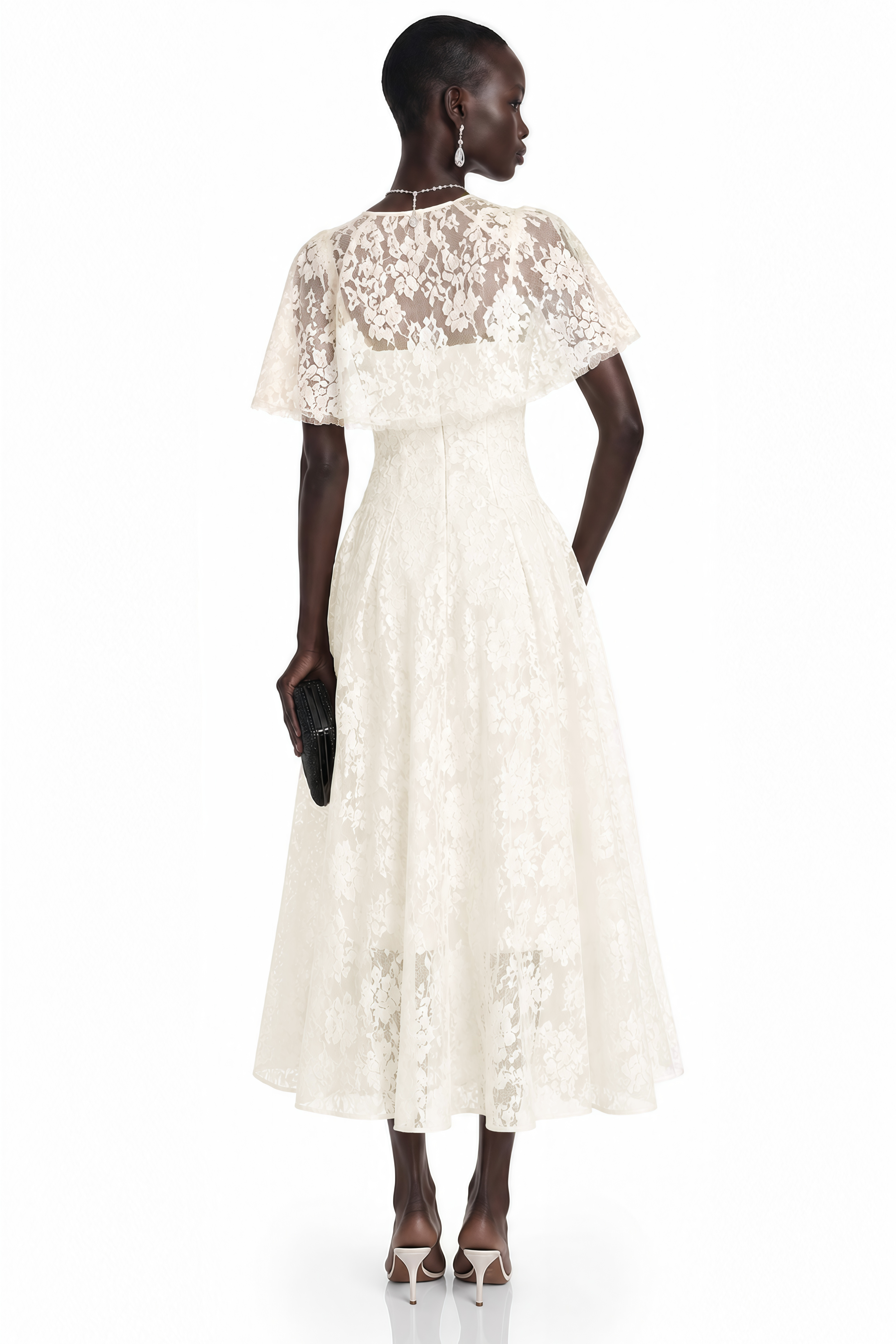 White lace midi dress with a fitted waist, cutout neckline, and short flutter cape sleeves