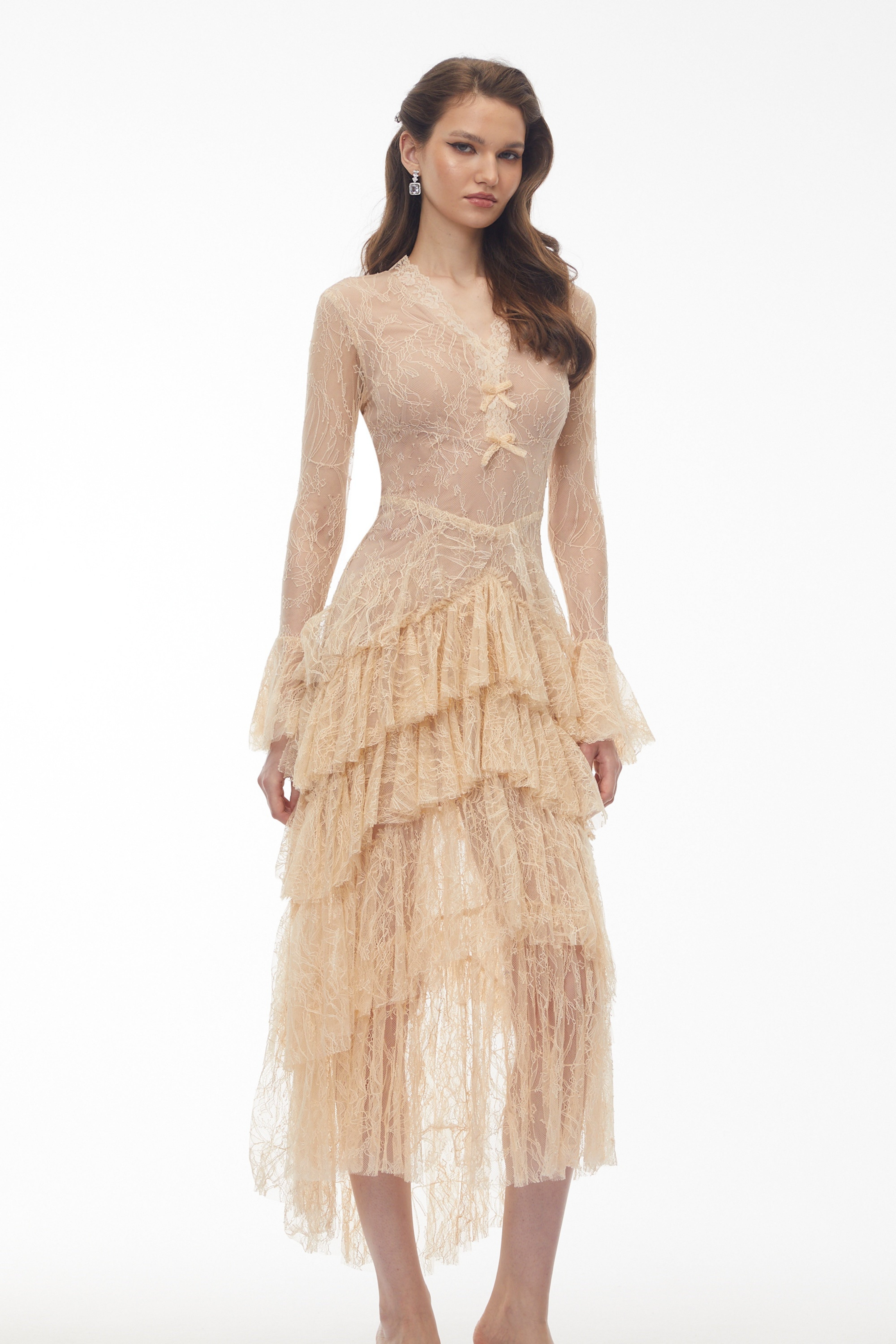 Beige lace gown with a tiered ruffled skirt