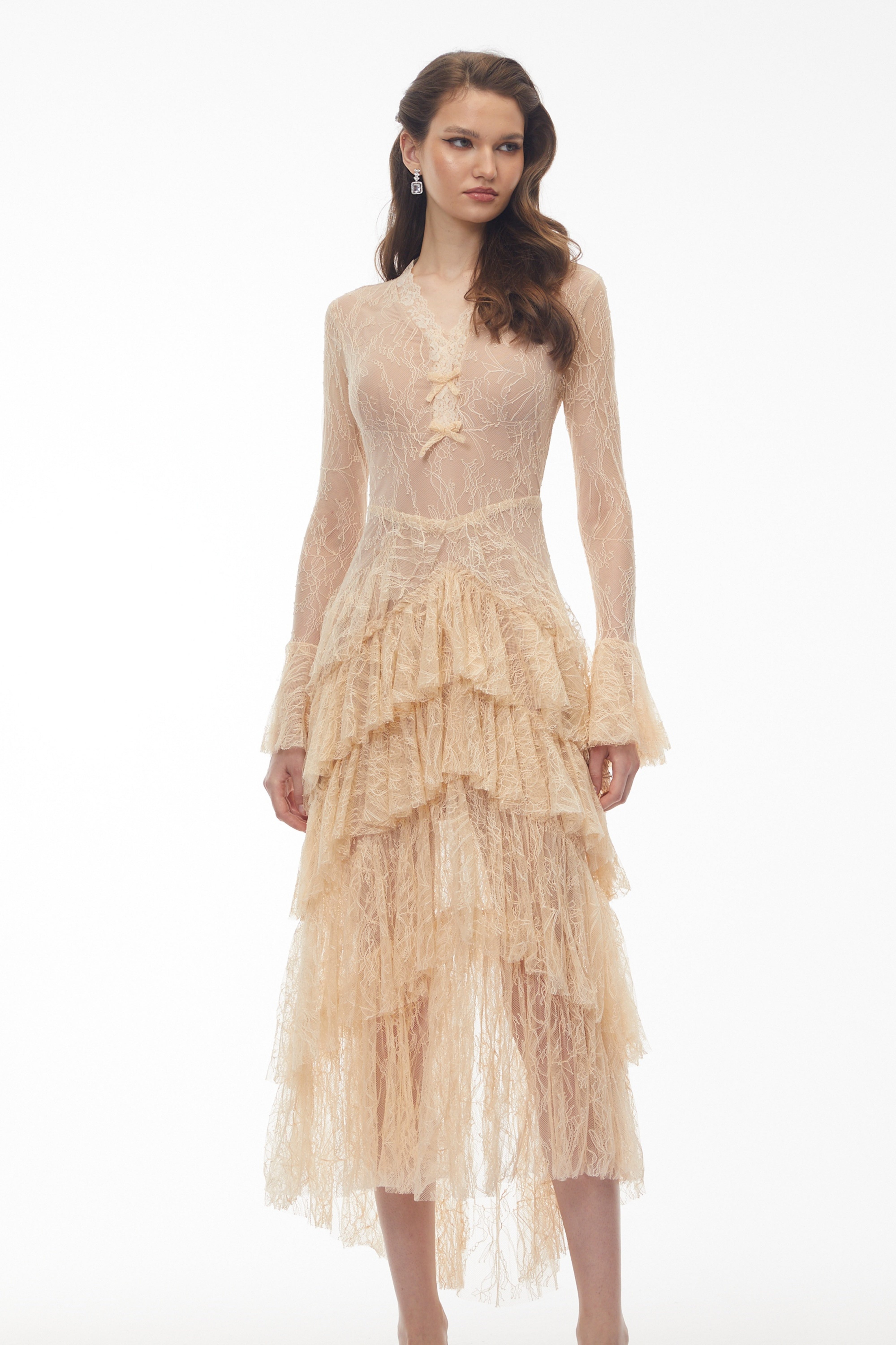 Beige lace gown with a tiered ruffled skirt