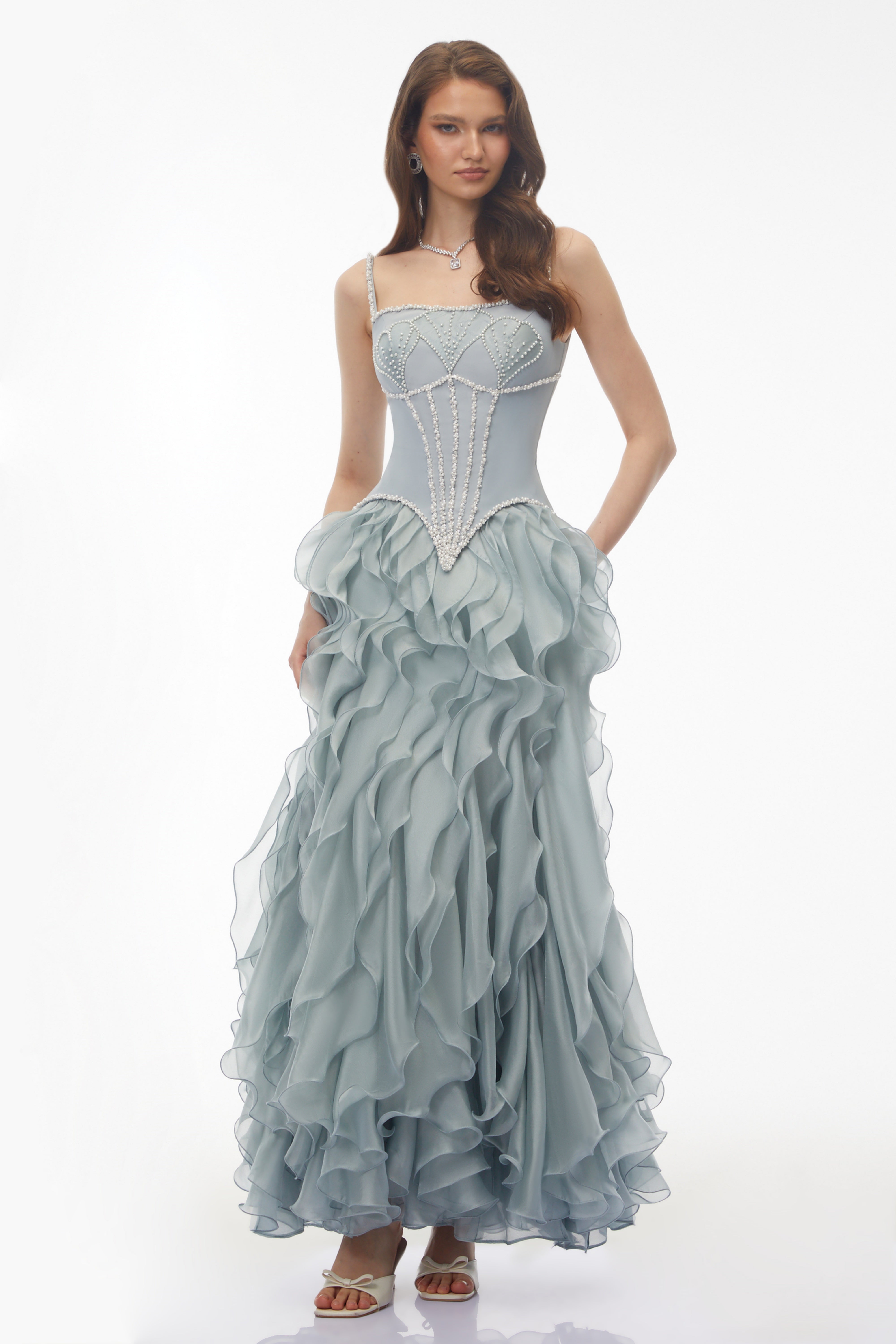 Dusty blue maxi dress with a pearl-embellished corset bodice and a tiered ruffled organza skirt
