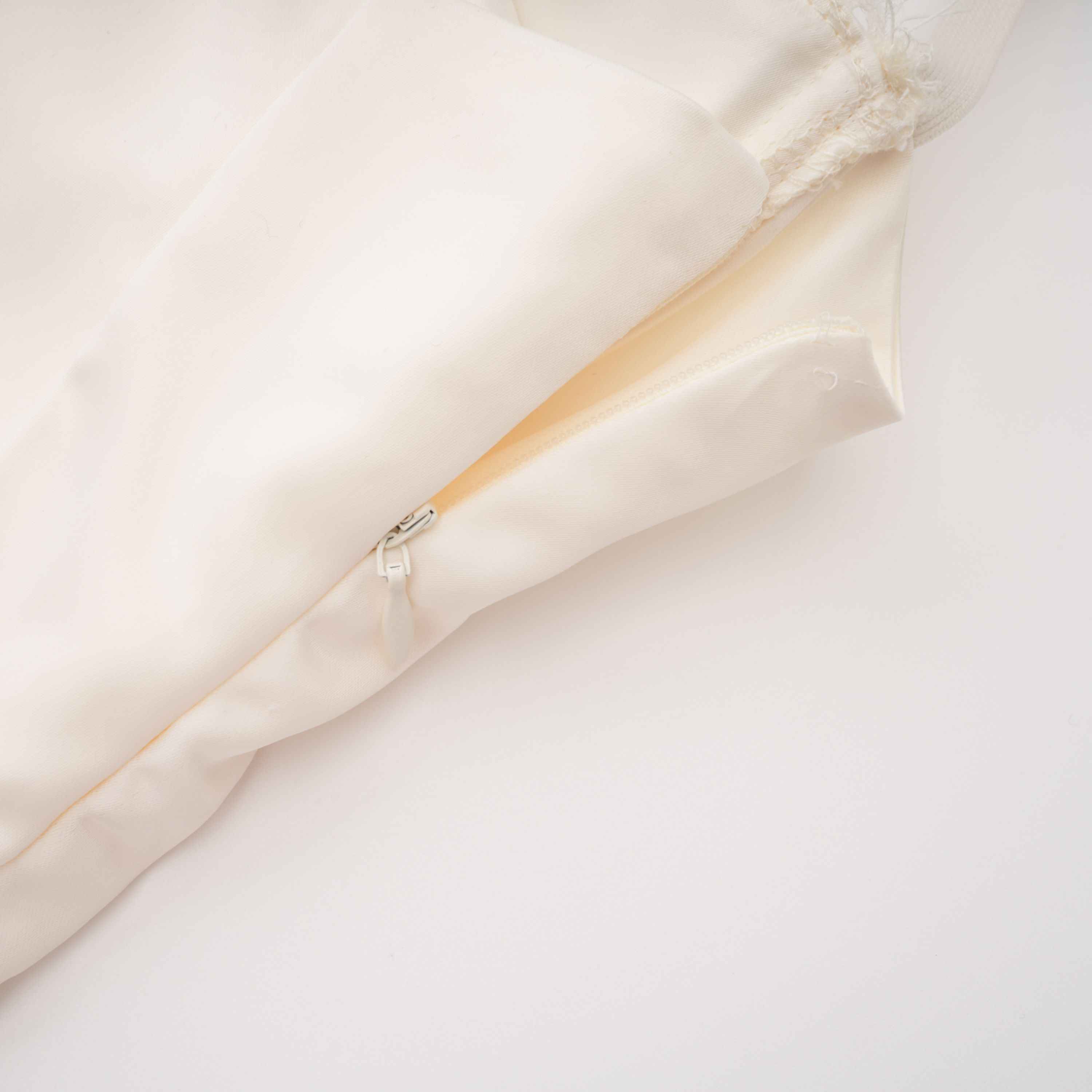 White satin corset mini dress with lace inserts and trim