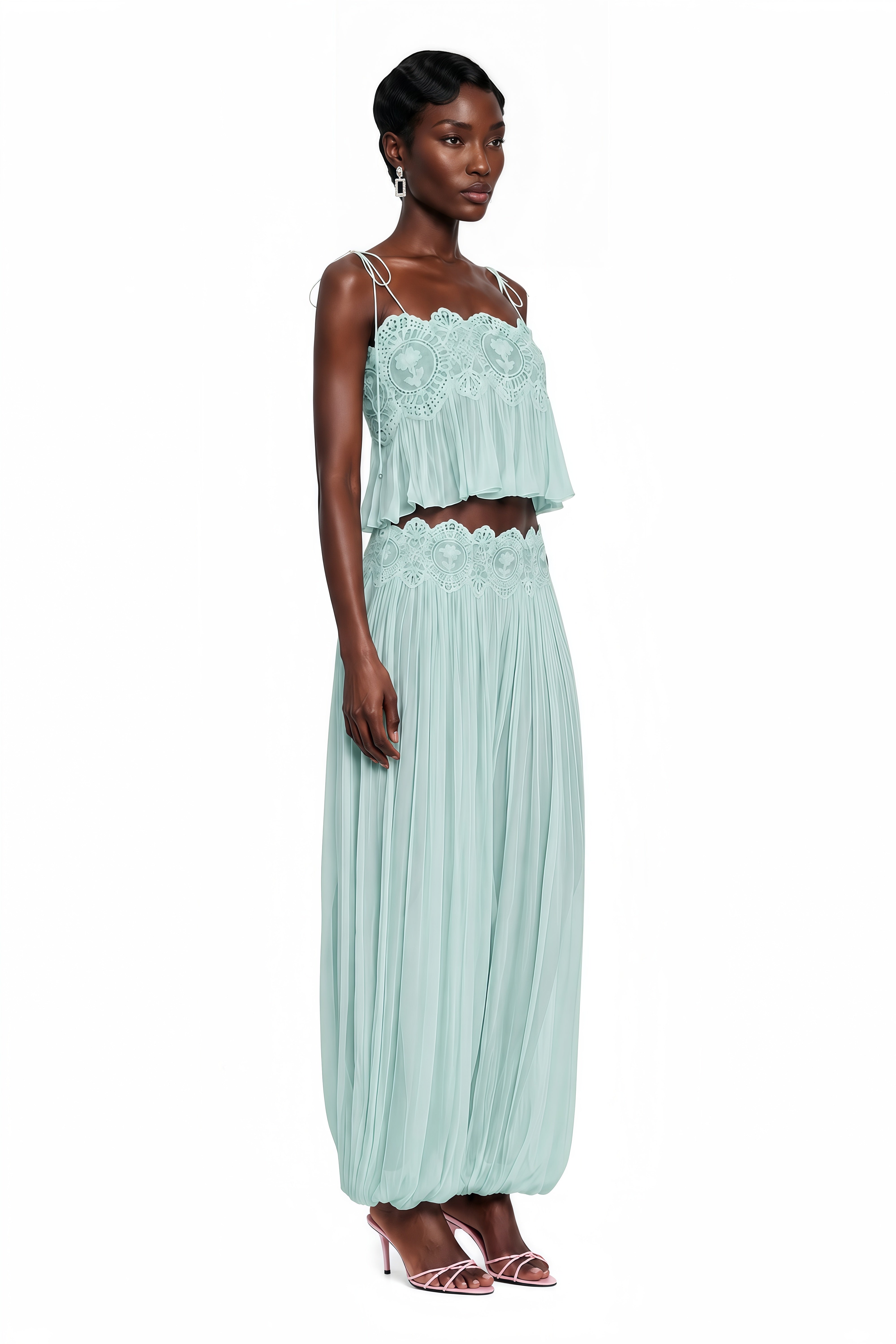 Light green two-piece set with a lace camisole crop top and matching pleated pants