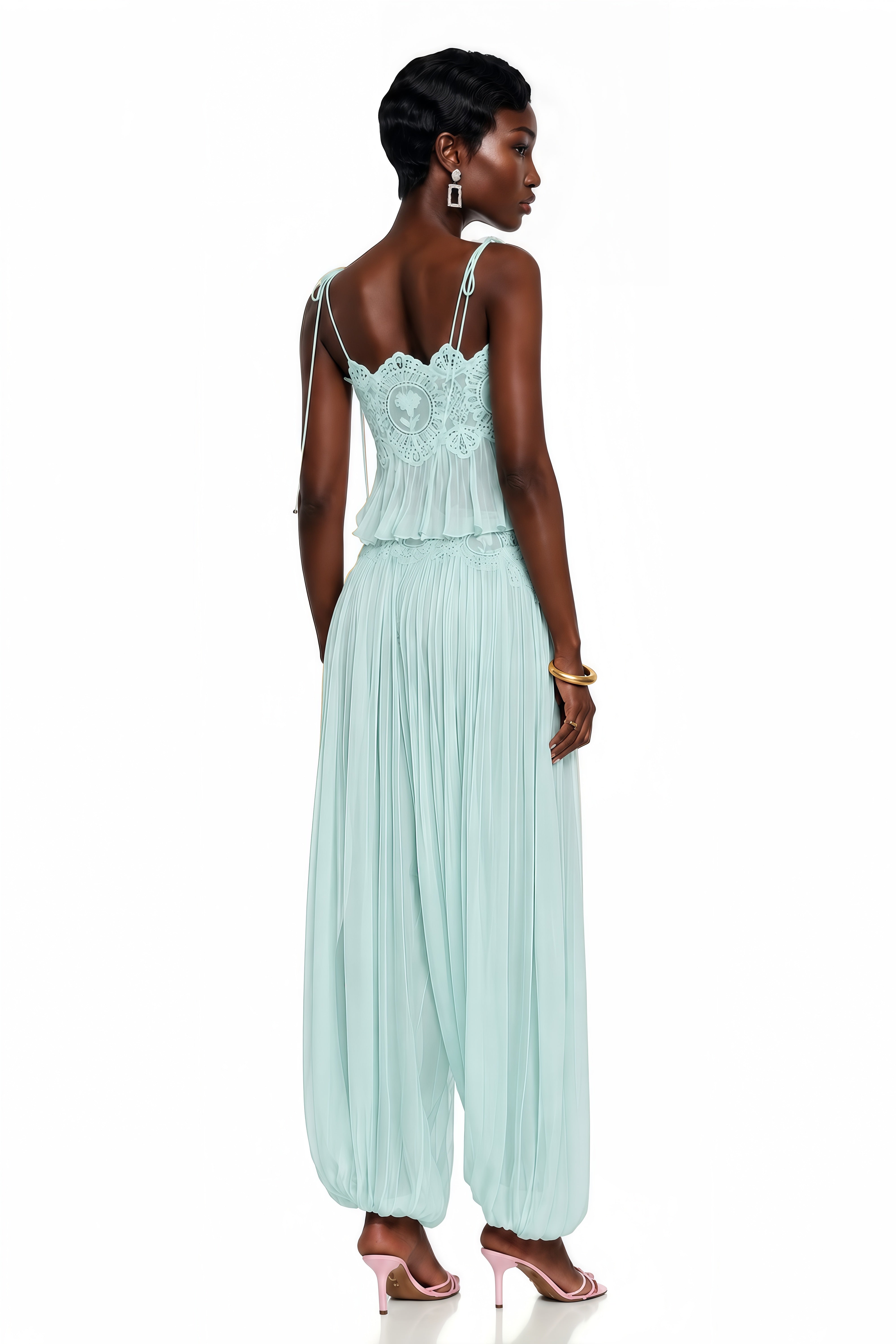 Light green two-piece set with a lace camisole crop top and matching pleated pants
