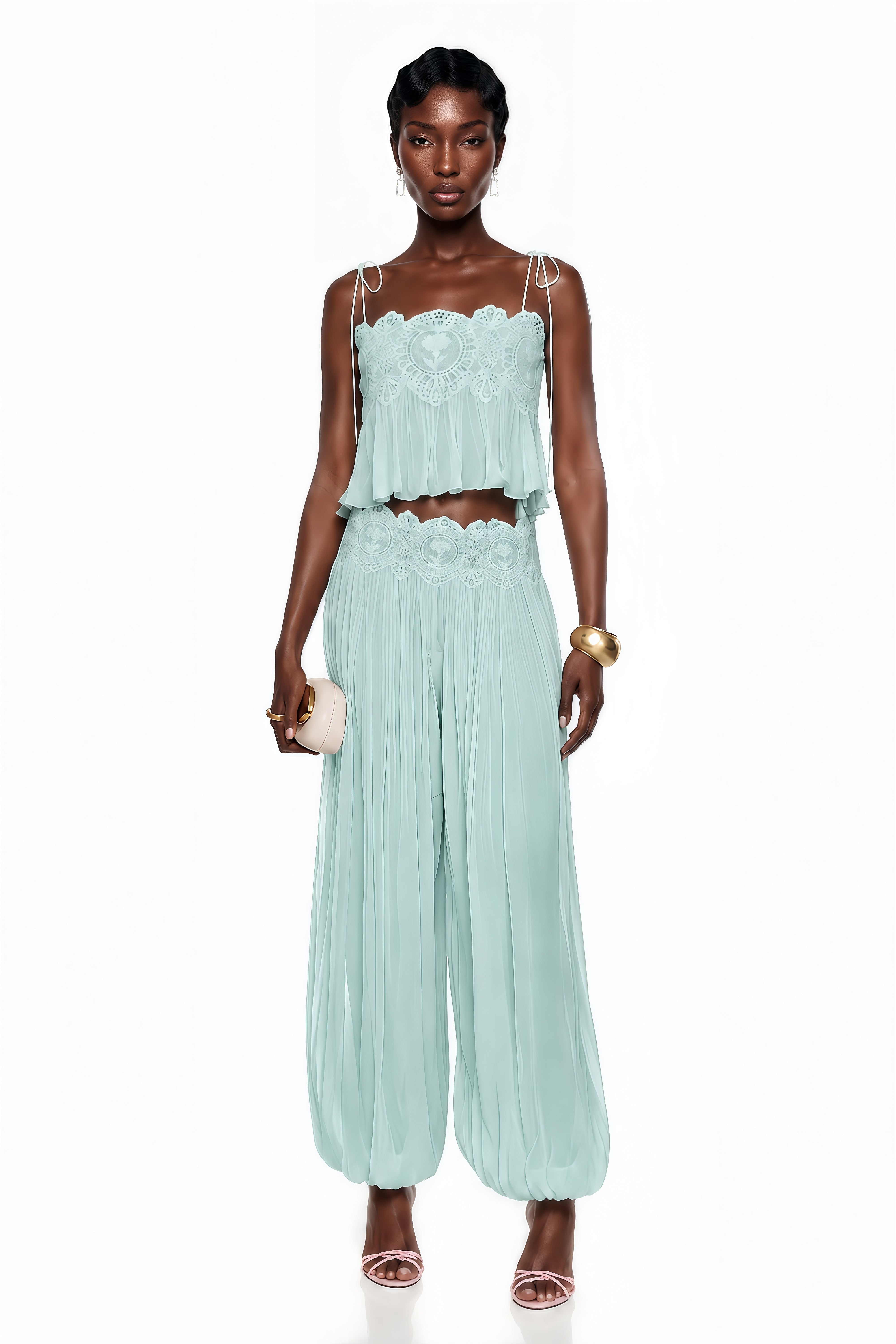Light green two-piece set with a lace camisole crop top and matching pleated pants