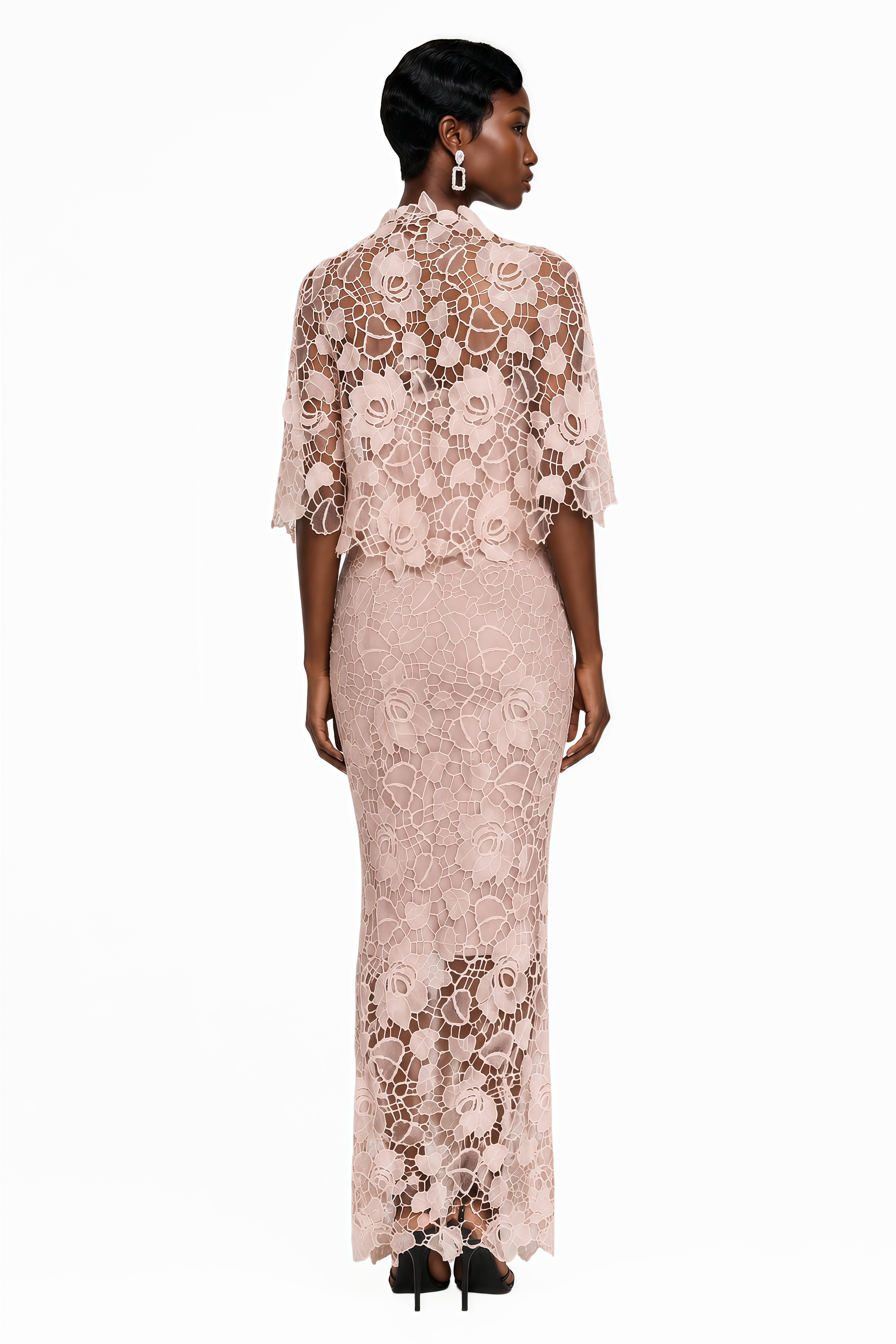 Blush pink lace maxi dress with a structured corset bodice, sweetheart neckline, and short cape overlay