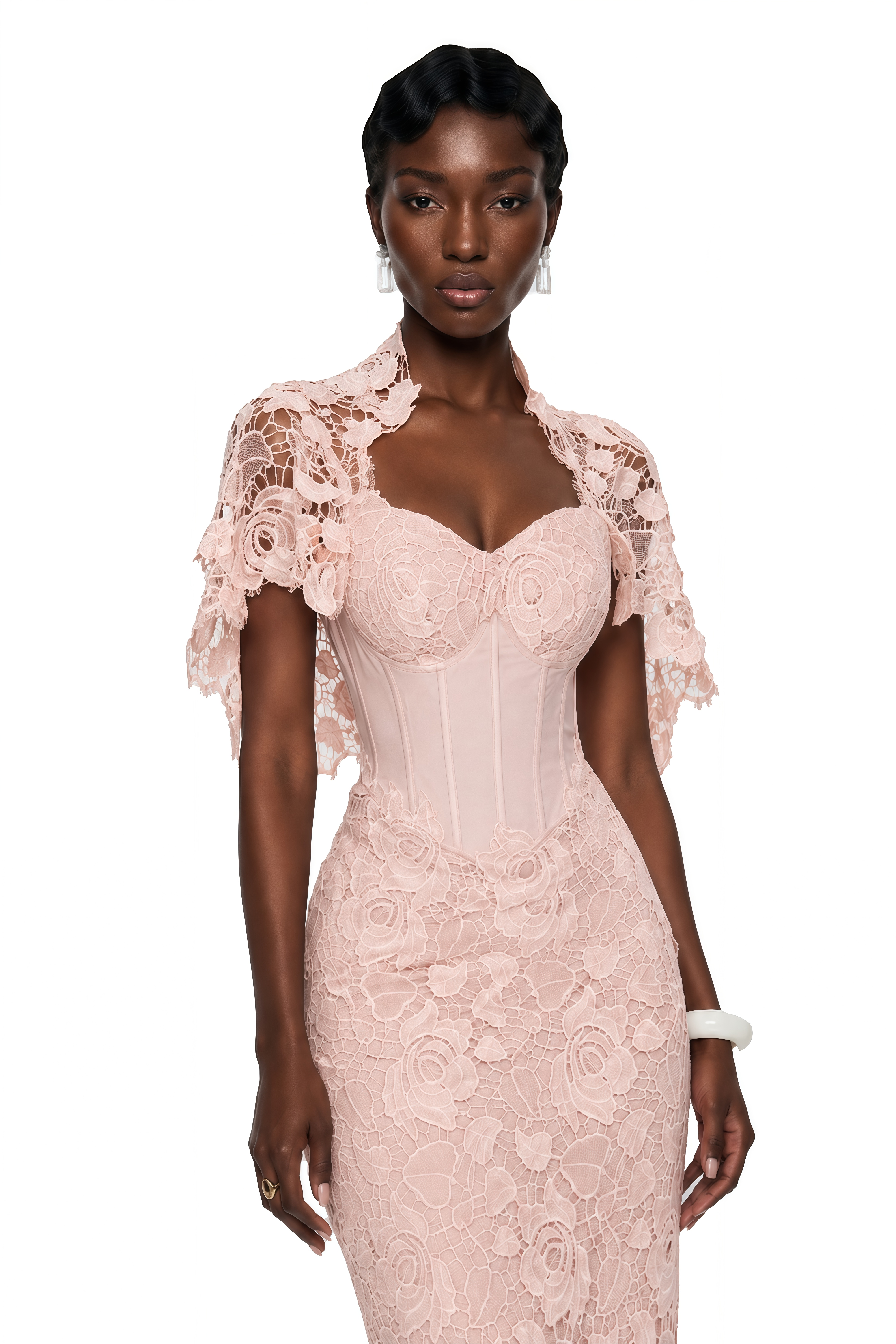 Blush pink lace maxi dress with a structured corset bodice, sweetheart neckline, and short cape overlay