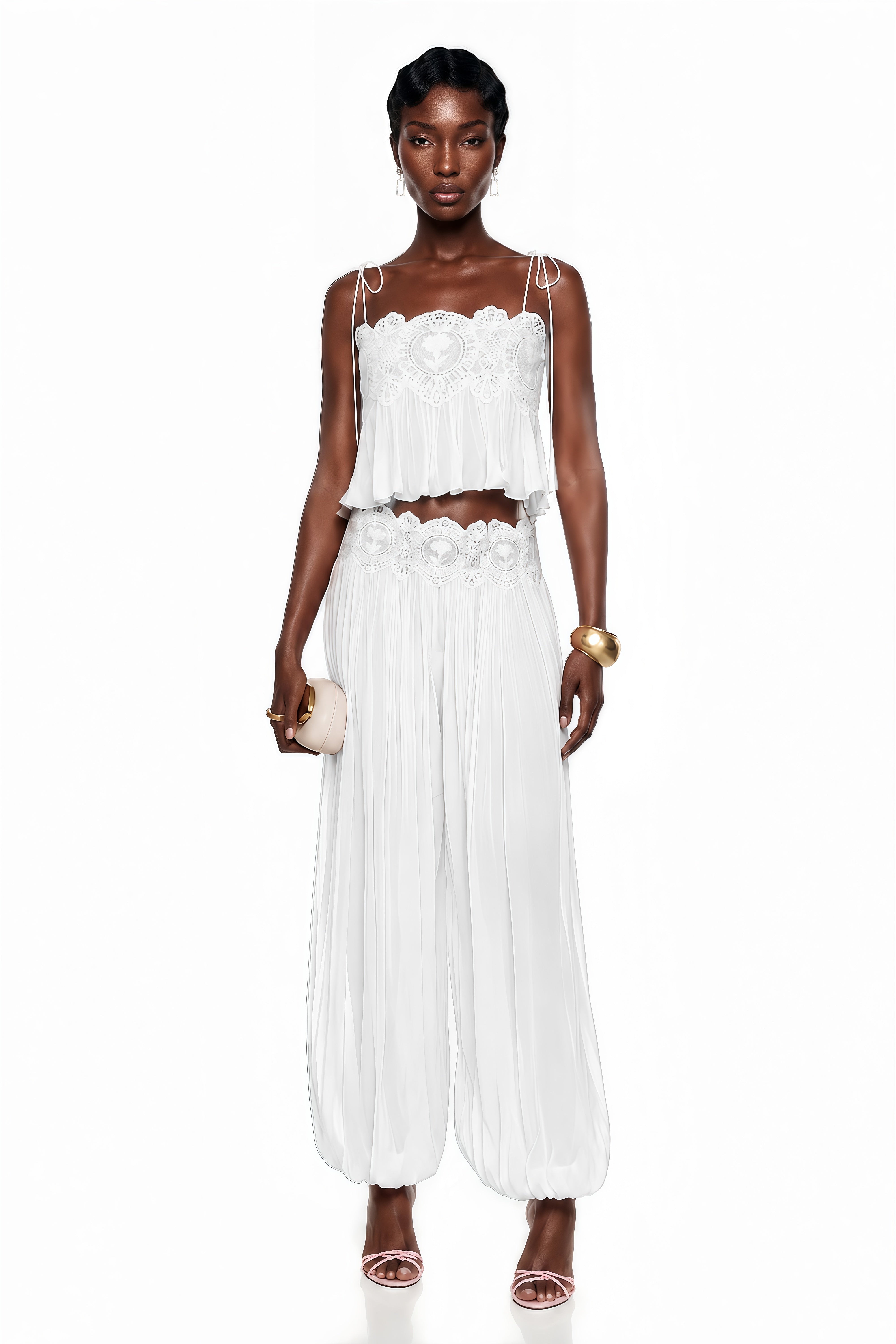 White two-piece set with a lace camisole crop top and matching pleated pants