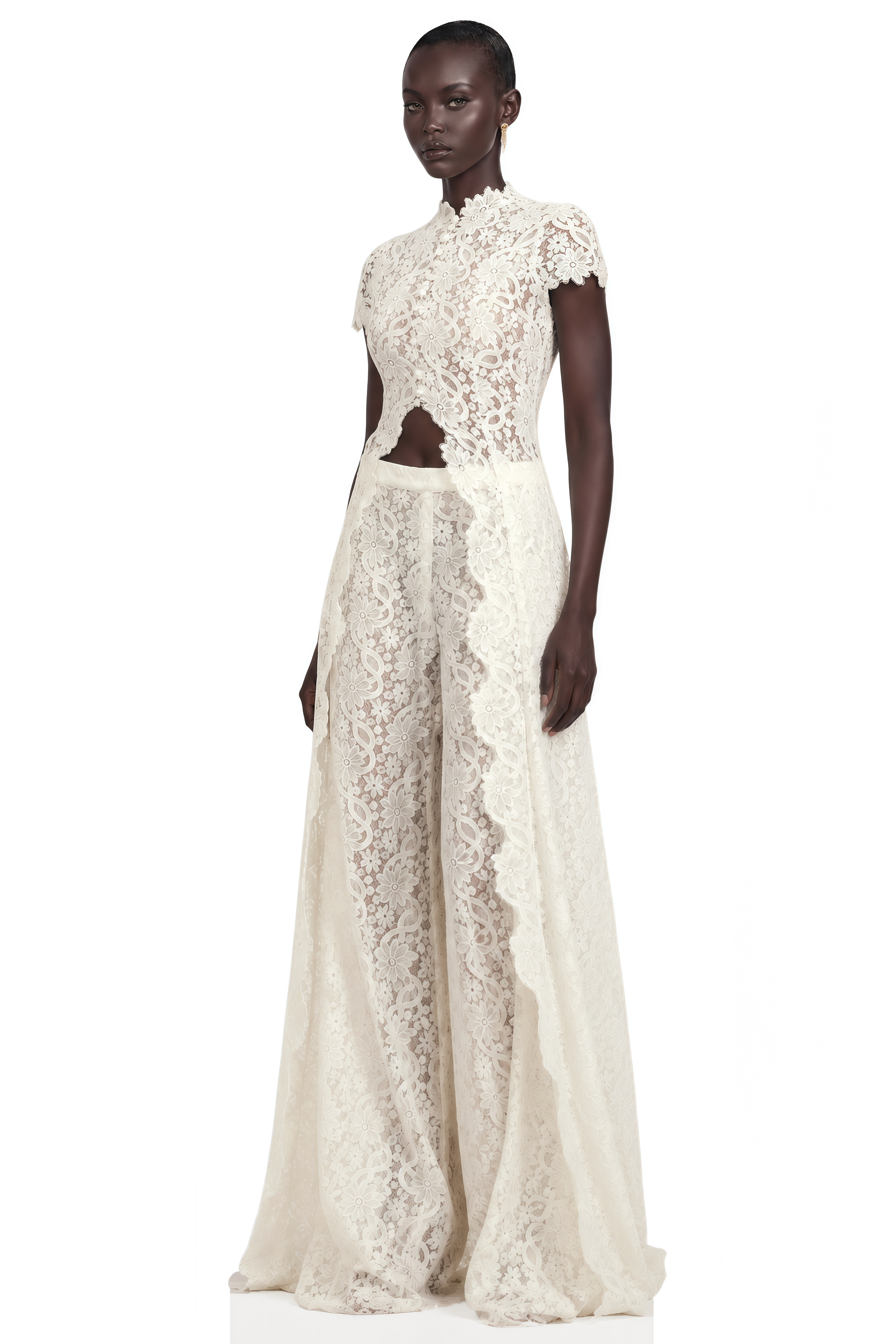 Black long-sleeve maxi dress with a sheer lace bodice and a draped skirt