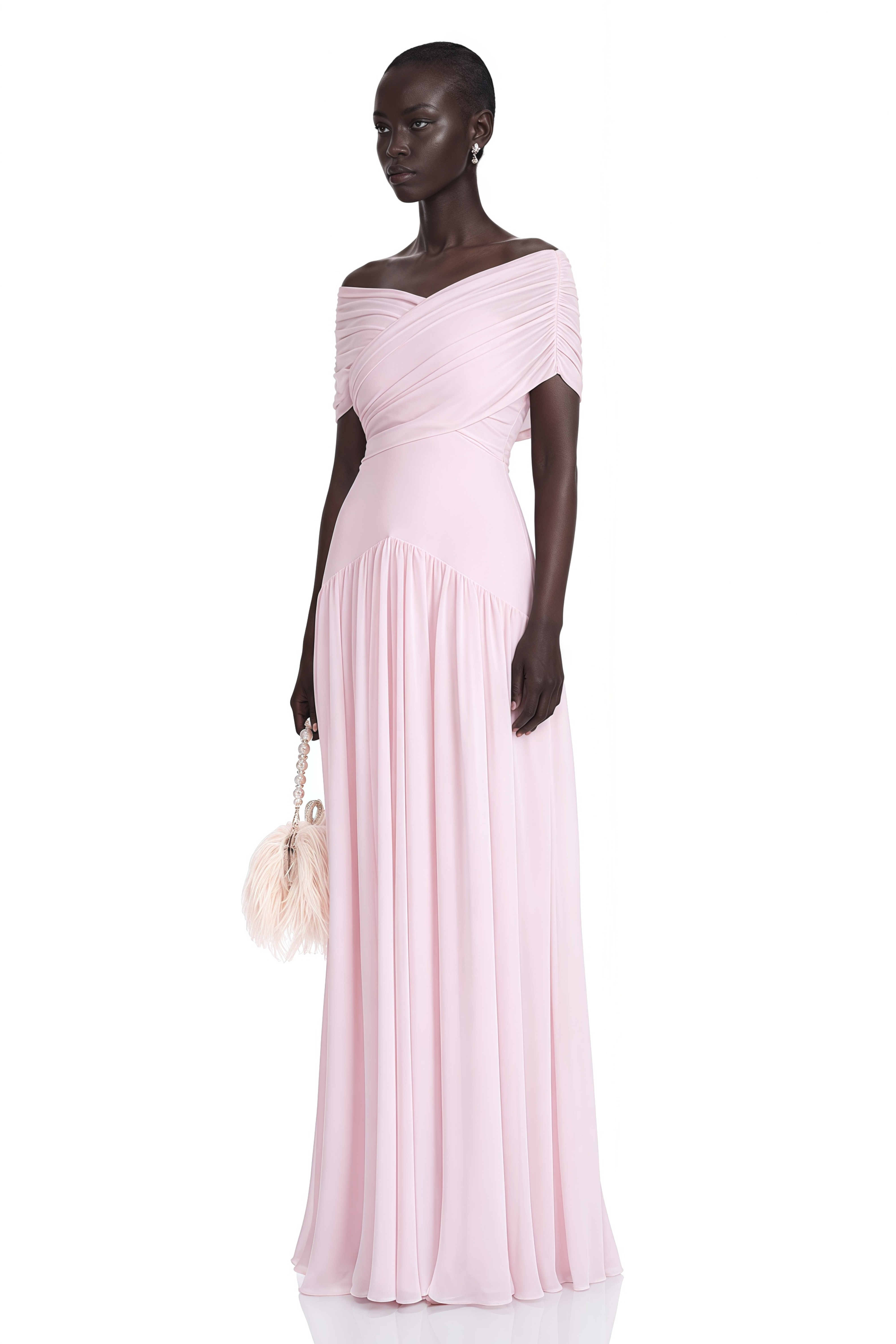 Light pink off-the-shoulder maxi dress with a criss-cross bodice and flowing skirt
