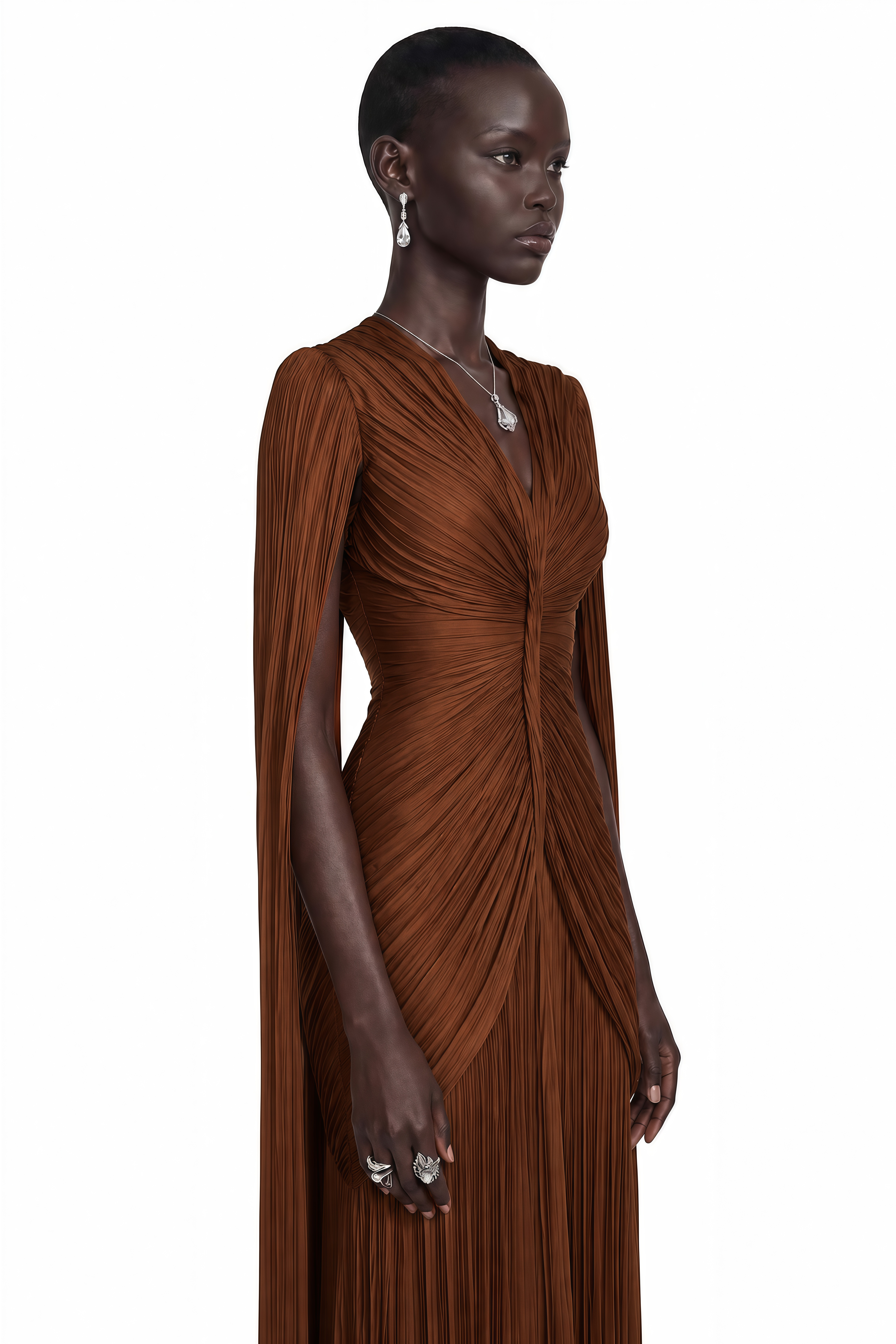 Brown plissé maxi dress with a ruched bodice, V-neckline, and floor-length cape sleeves