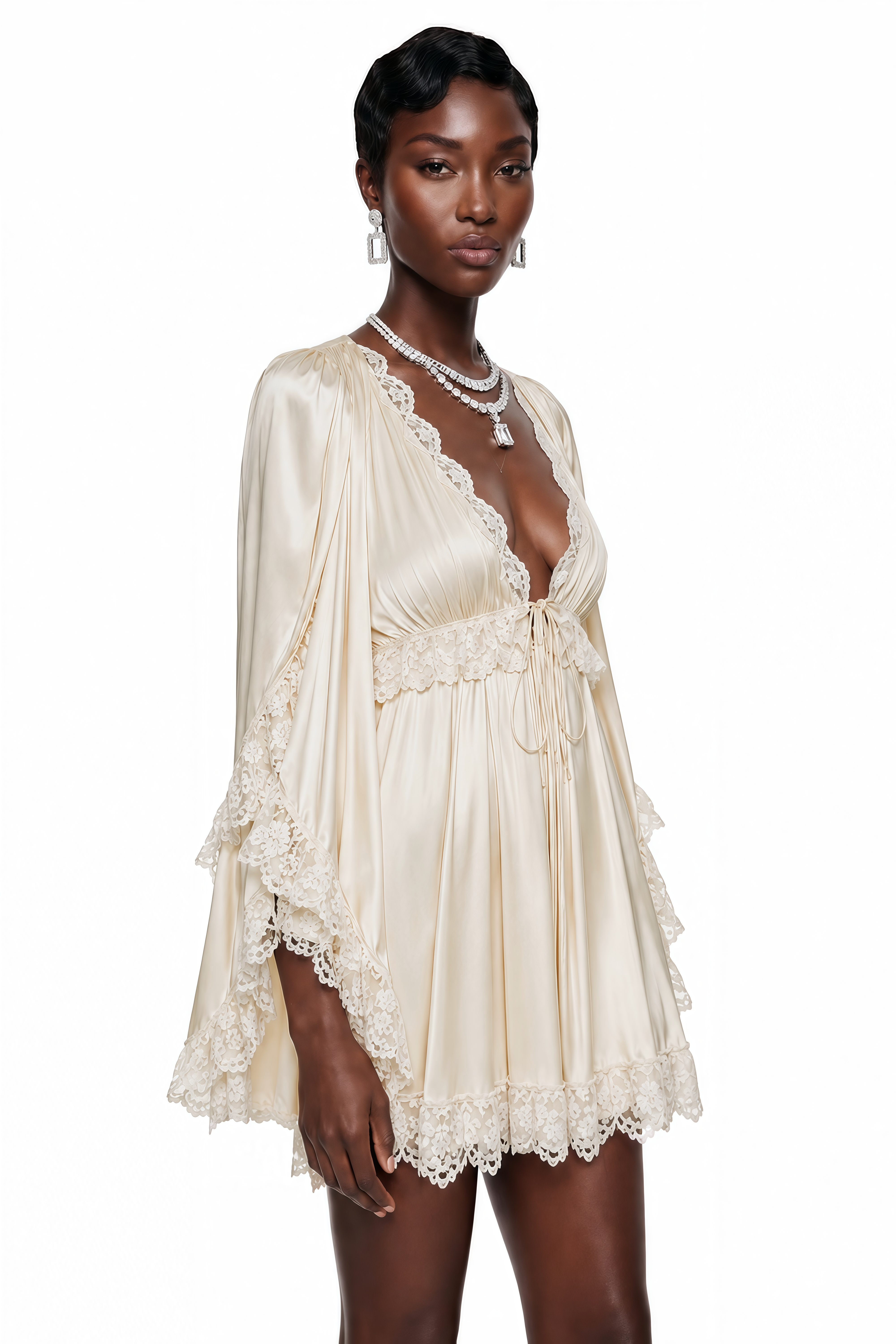 Cream satin v-neck mini dress with tiered lace-trimmed bell sleeves and a matching lace hem