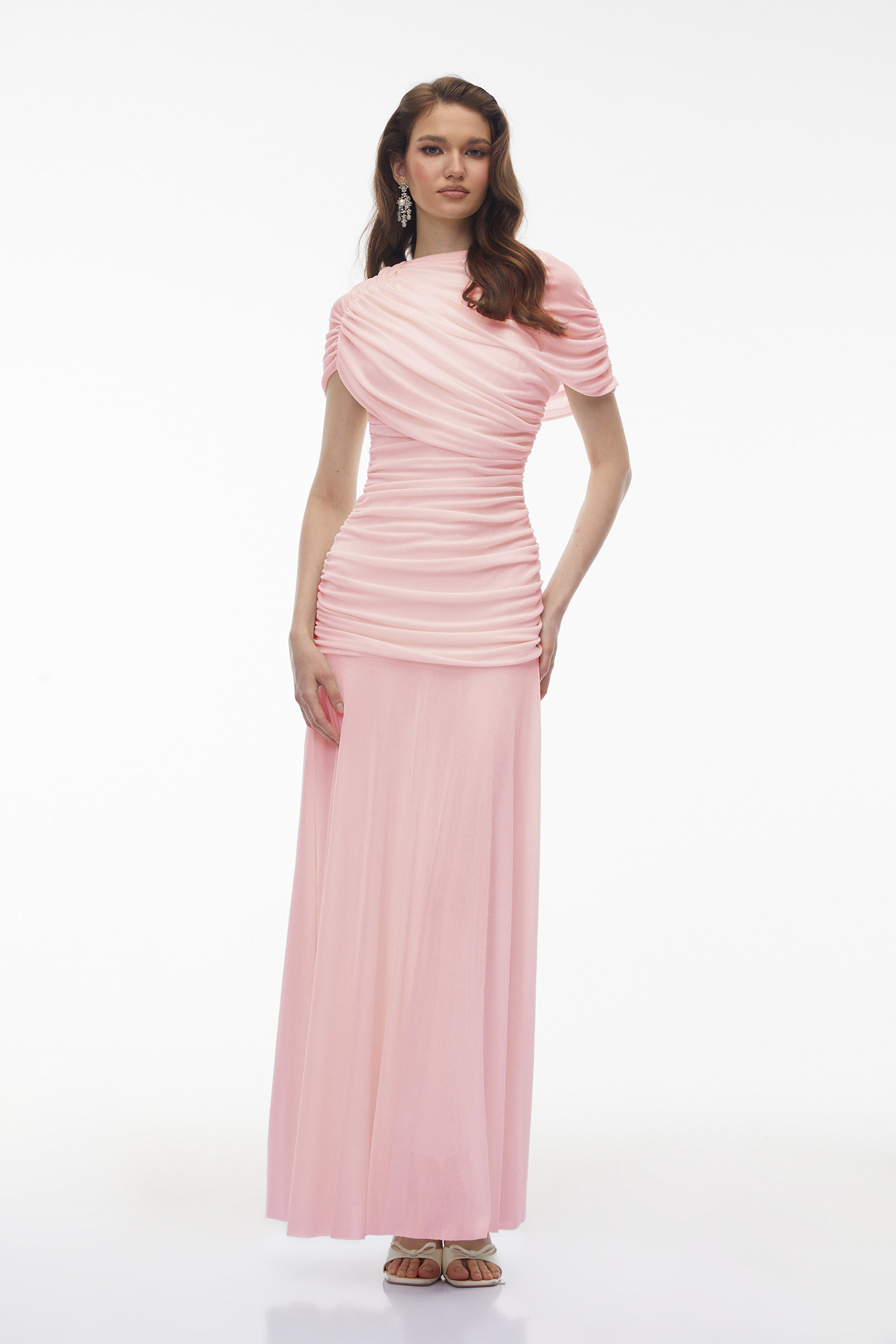 Light pink maxi dress with an asymmetric draped cowl neckline, a ruched bodice, and a flowing skirt
