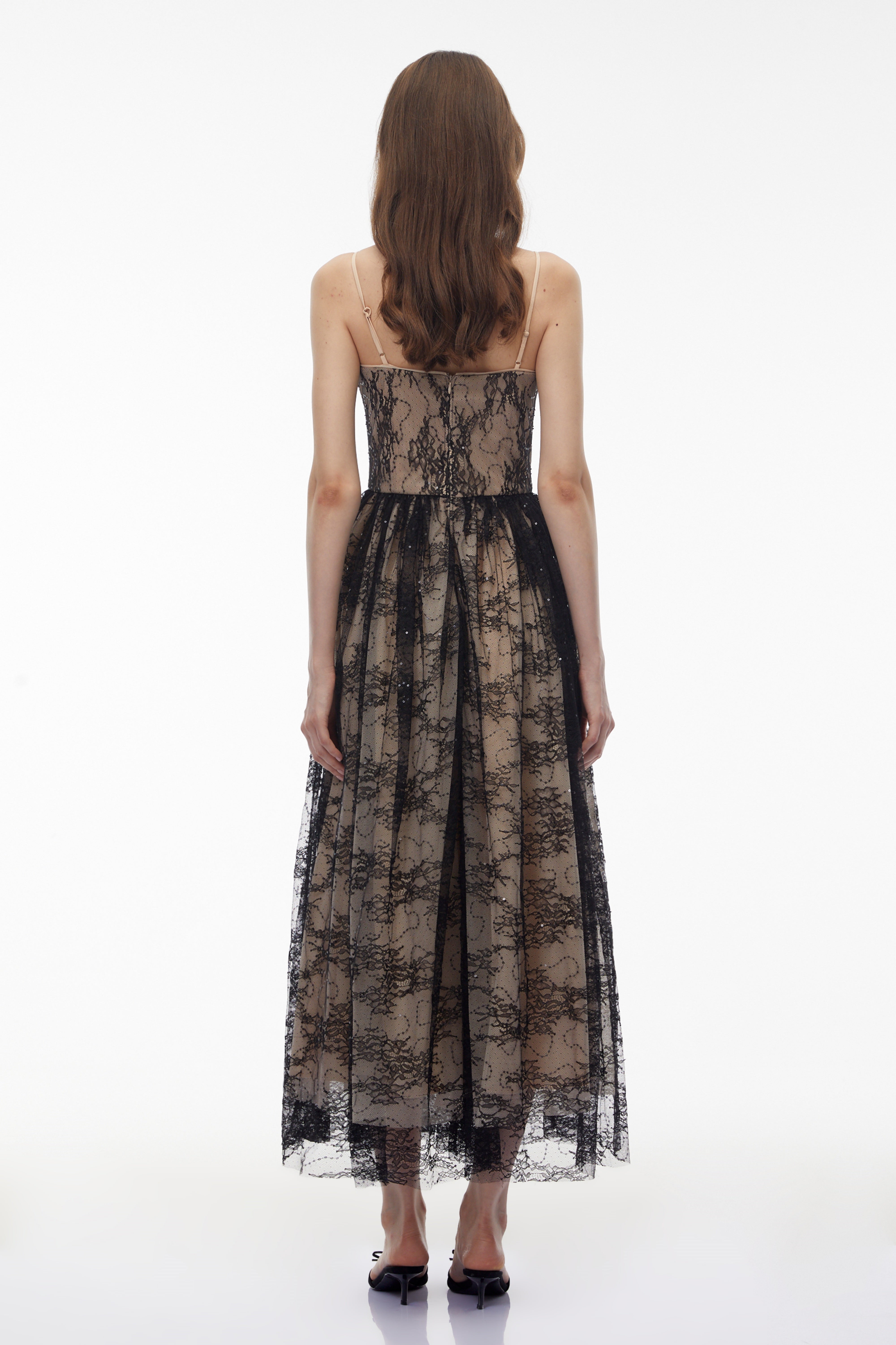 Black lace maxi dress with nude lining and feather trim