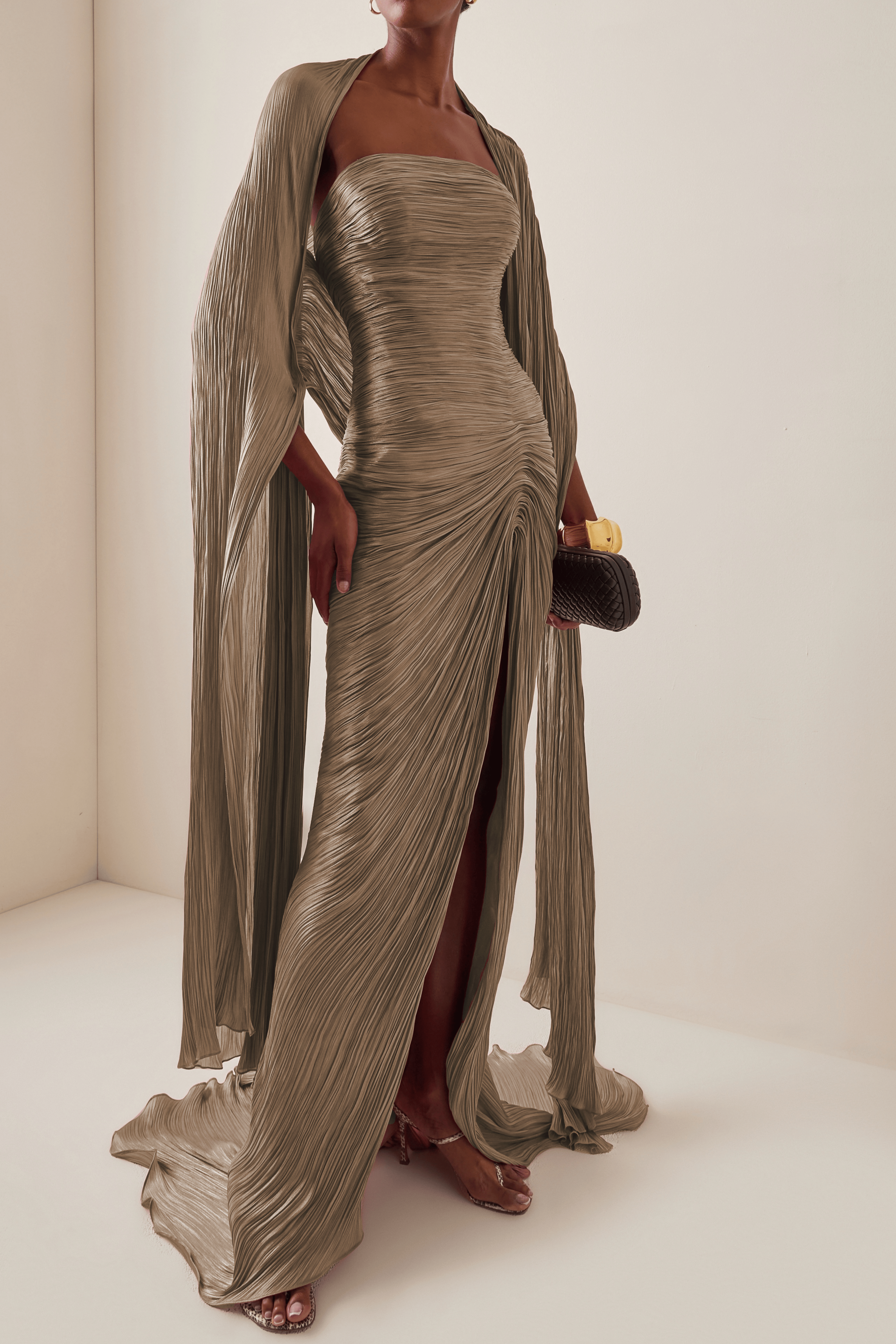 Taupe brown plissé pleated strapless maxi dress with a high front slit and a matching long cape scarf