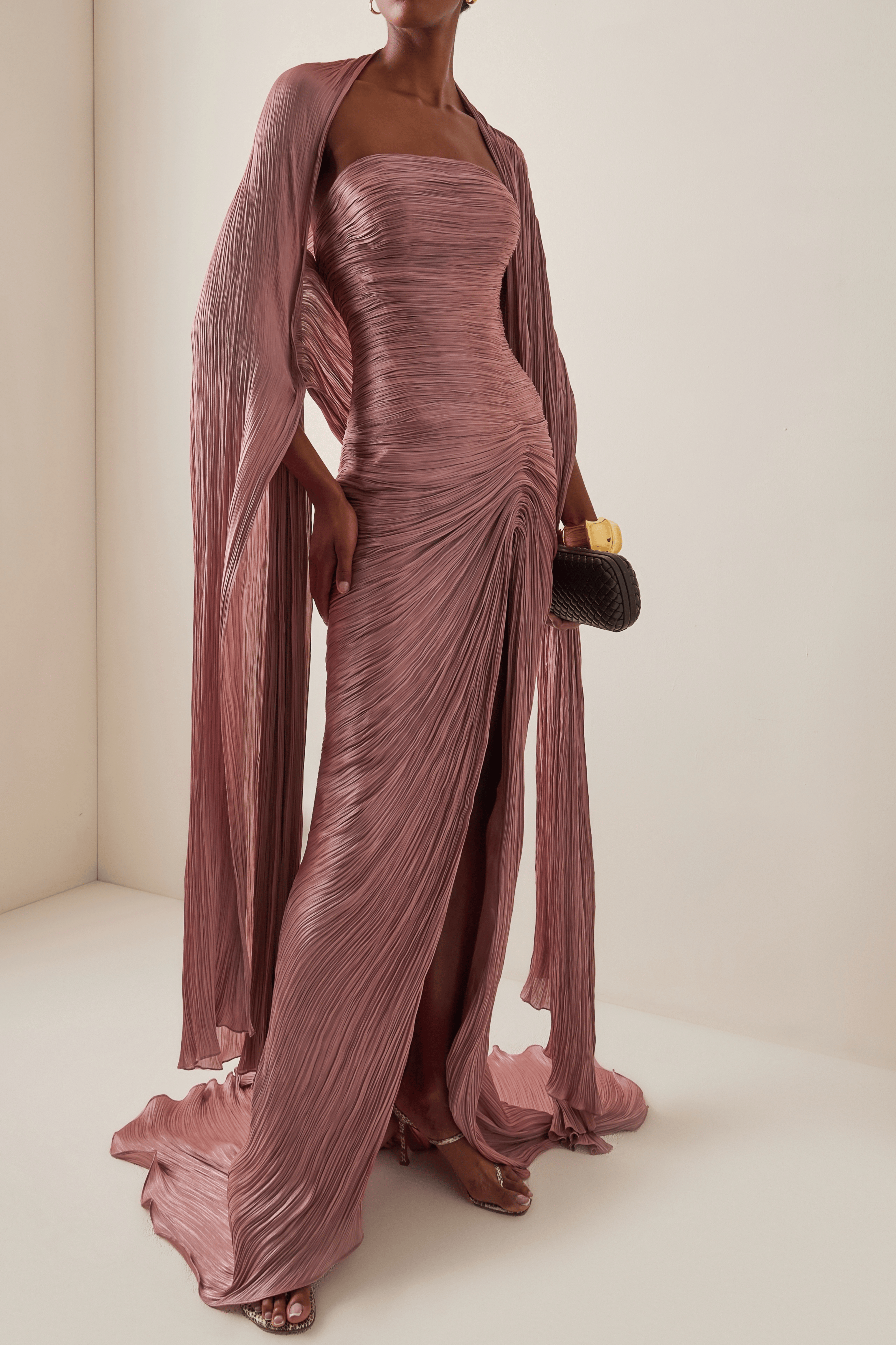 Mauve plissé strapless maxi dress with a front slit and matching floor-length cape