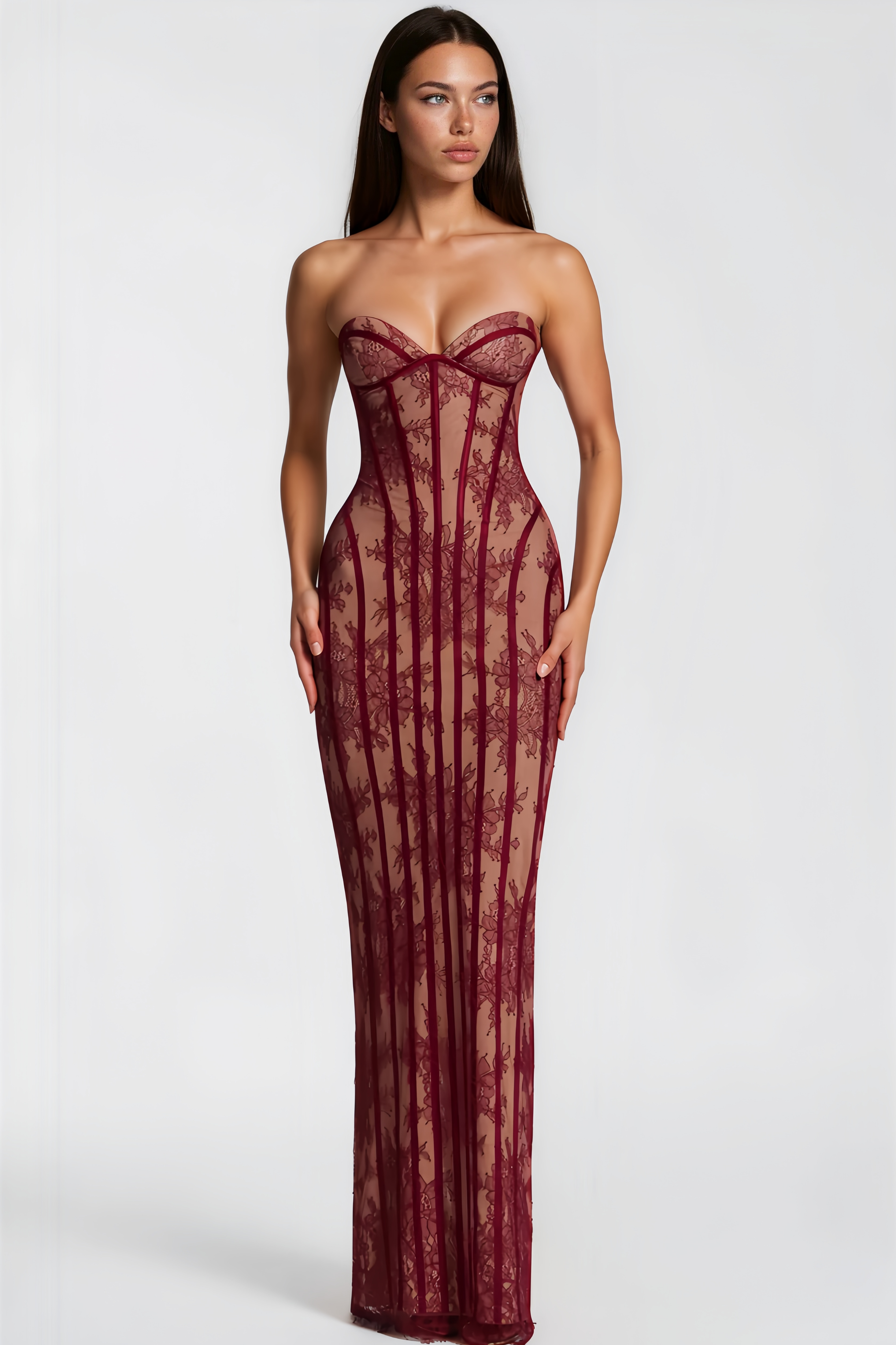 Burgundy strapless maxi dress featuring a nude lining with floral lace overlay and structured corset boning