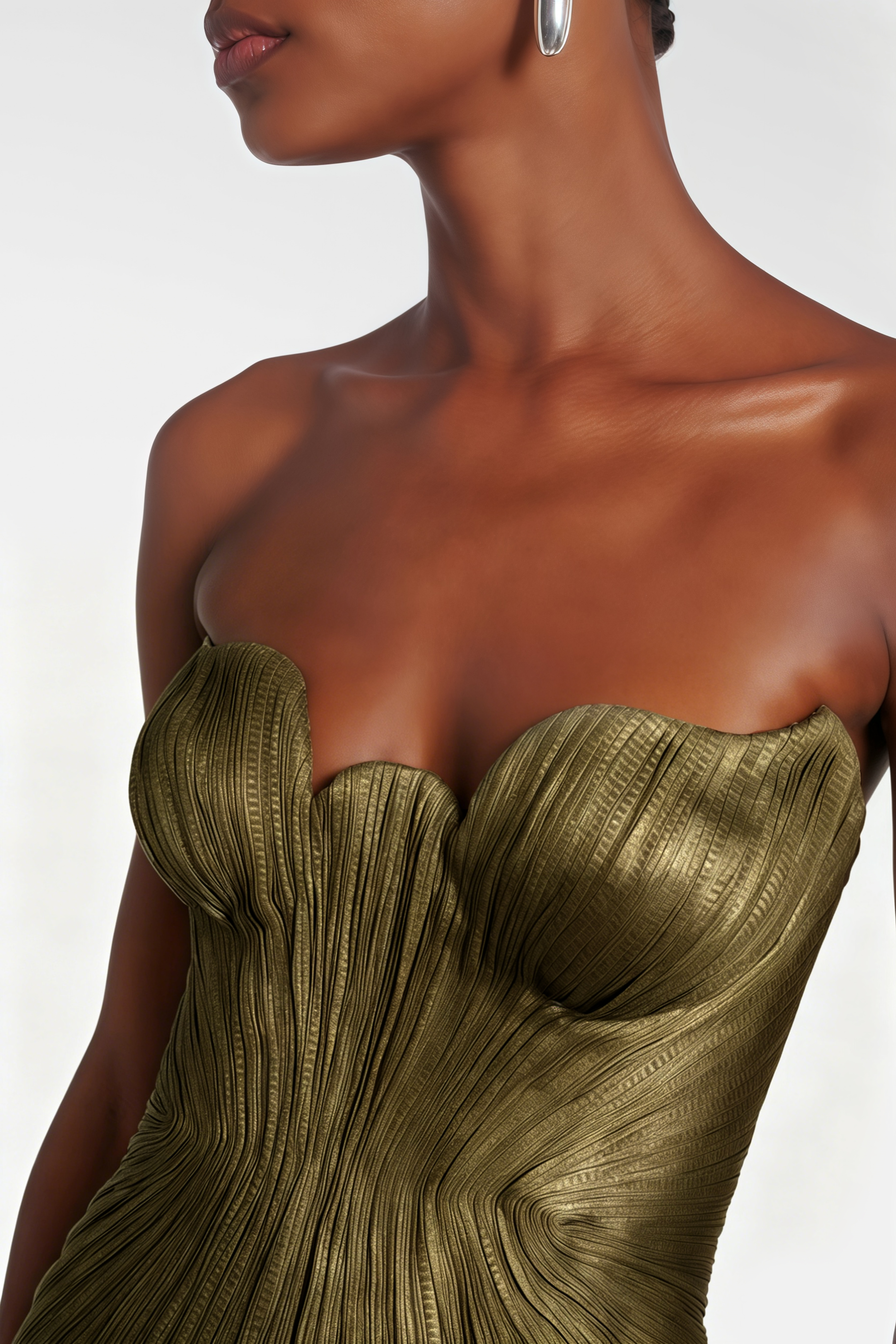 Strapless metallic olive green pleated maxi dress with sweetheart neckline and high thigh slit