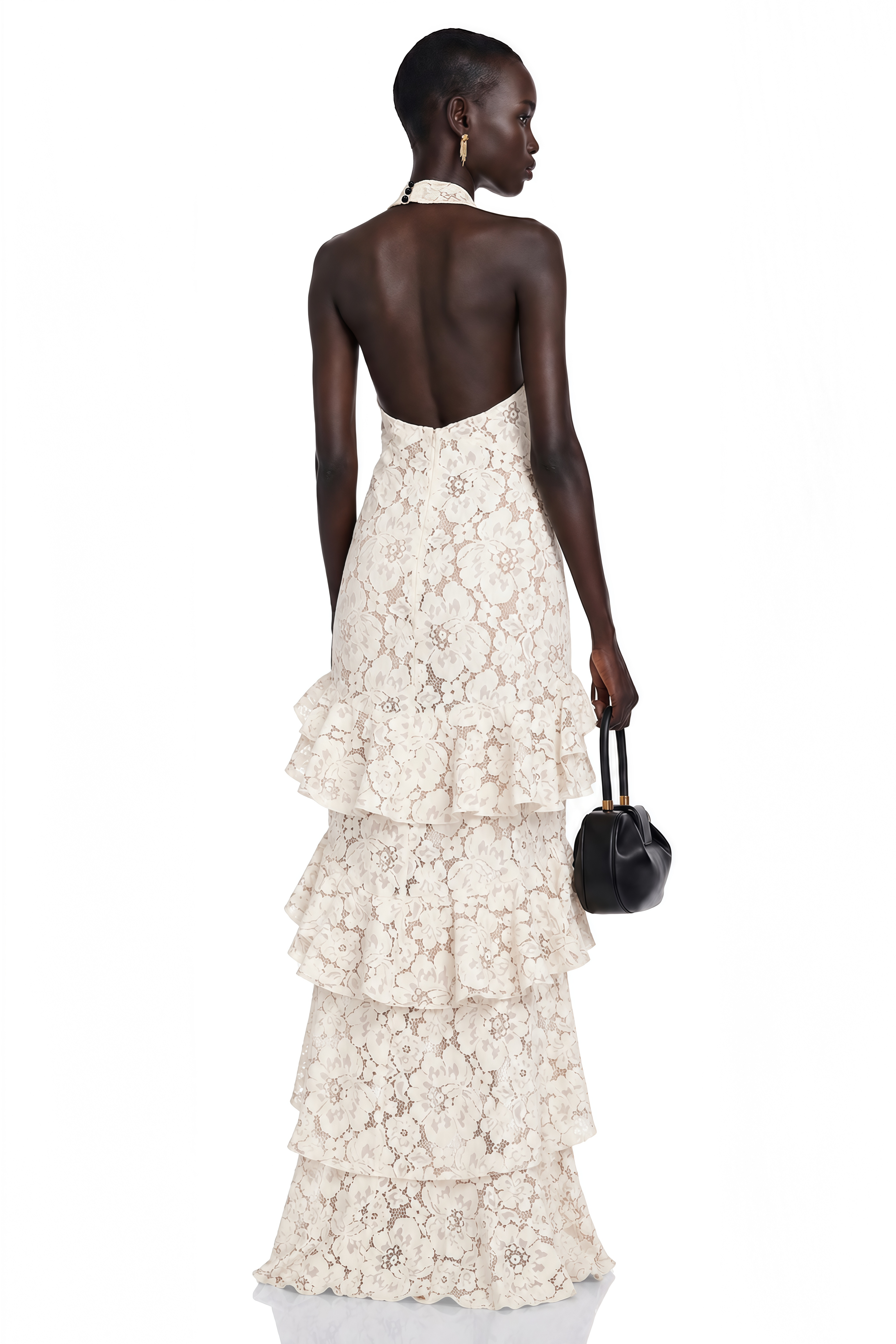Cream lace halter maxi dress with a black bow and tiered ruffled skirt