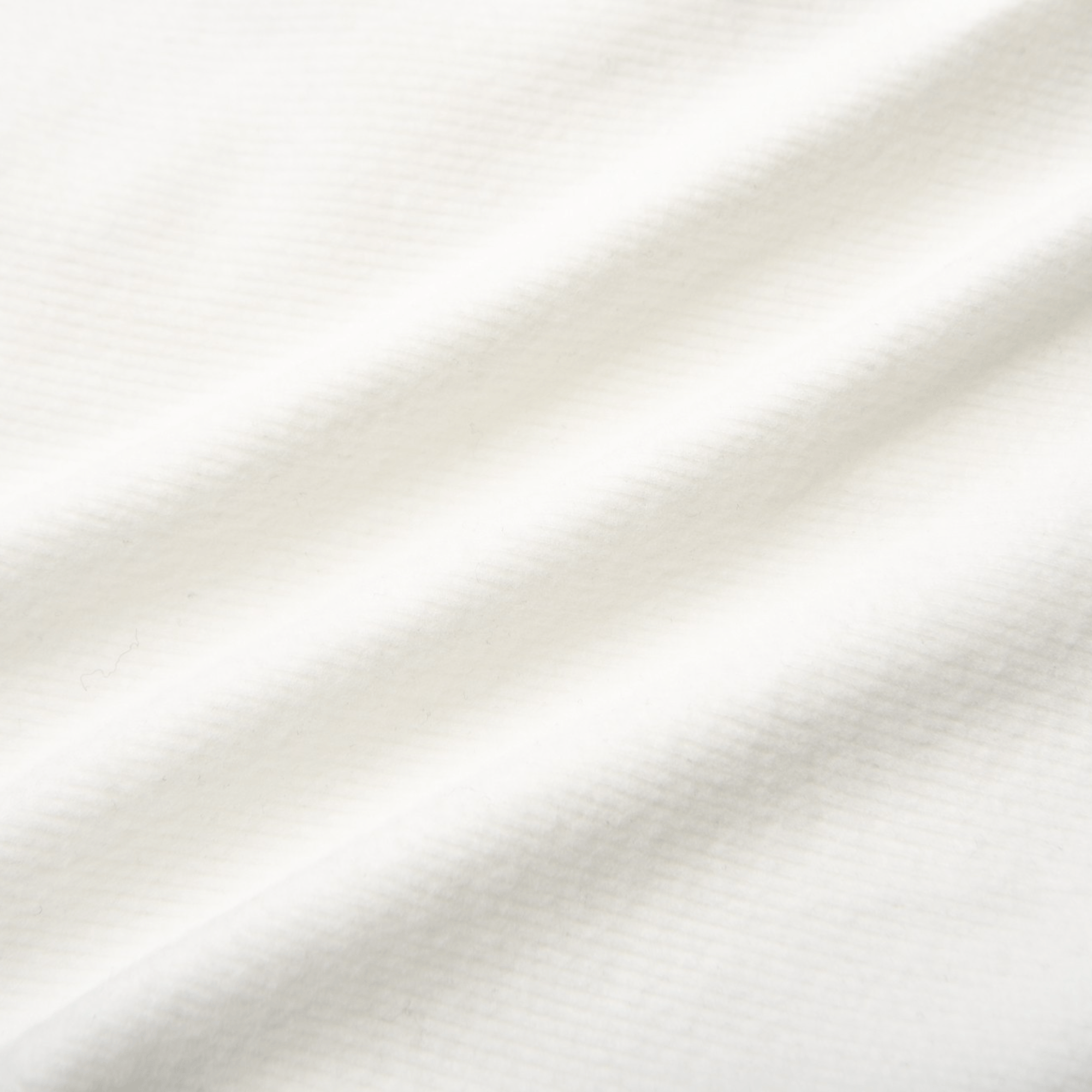 White long-sleeve crop top with a square neckline and front hook-and-eye closures