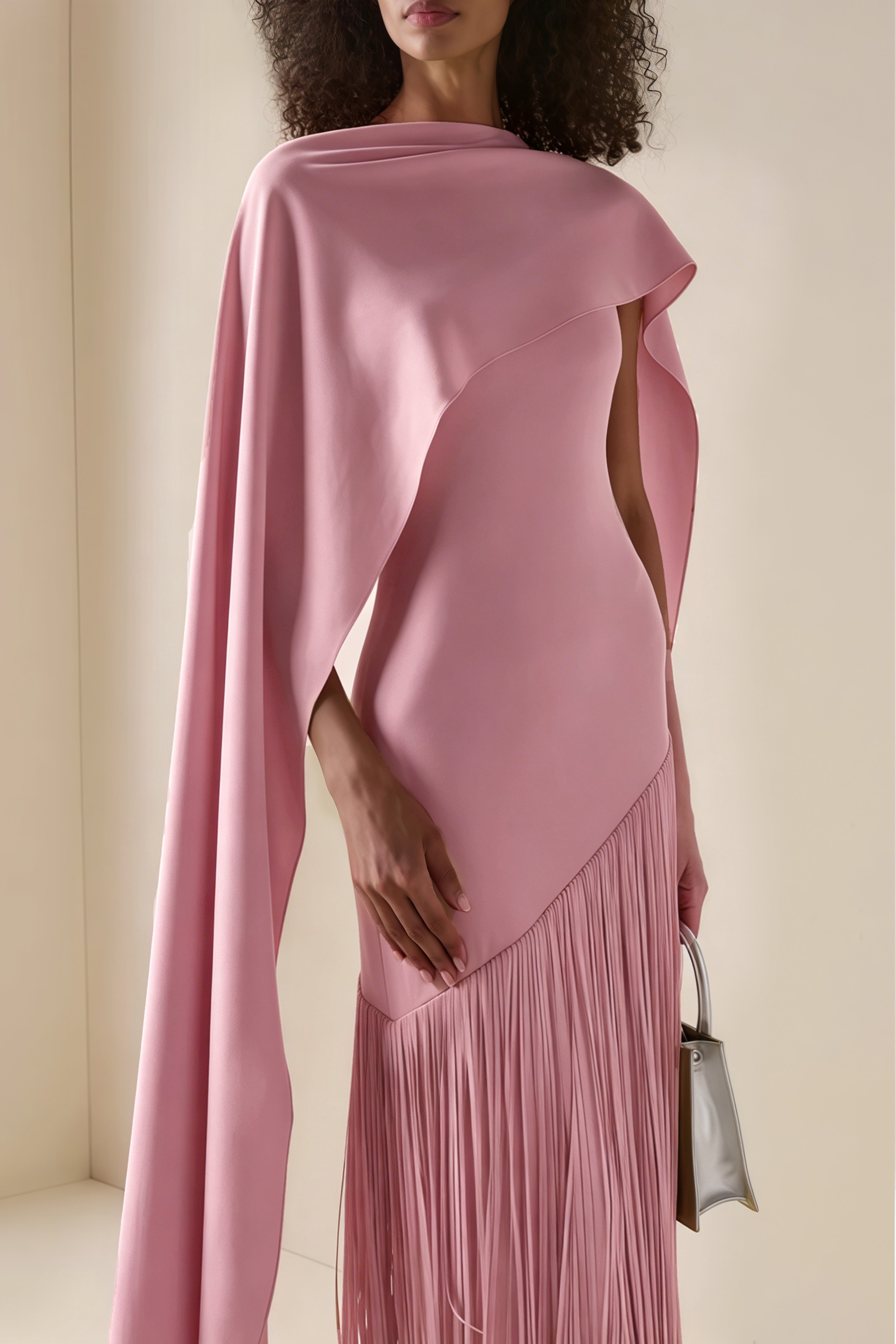 Mauve pink cape-style gown with a long fringed skirt