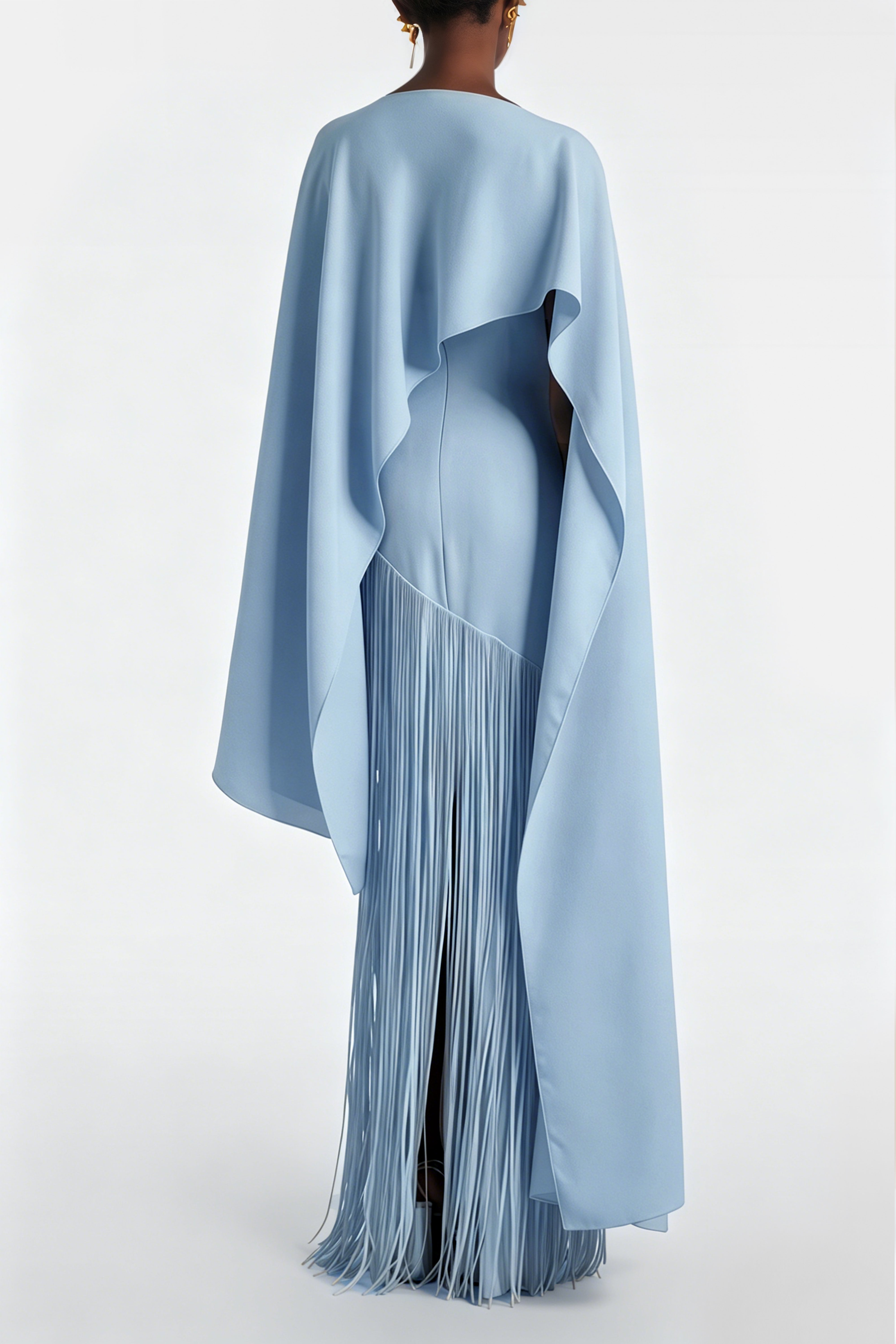 Light blue cape-style gown with a long fringed skirt