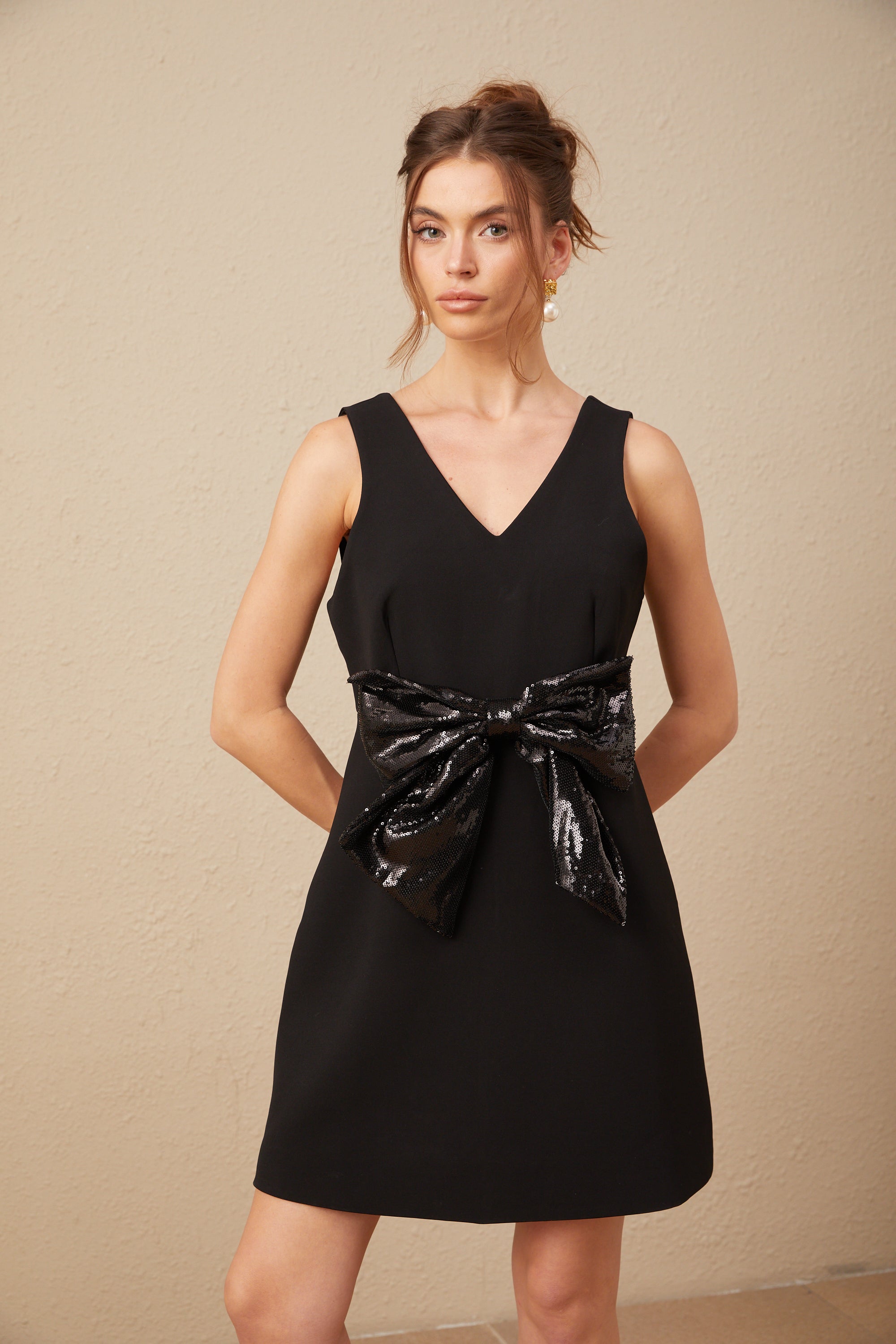 Roxane V-neck sequin-bow mini dress in Black (Final Sale-US Only)