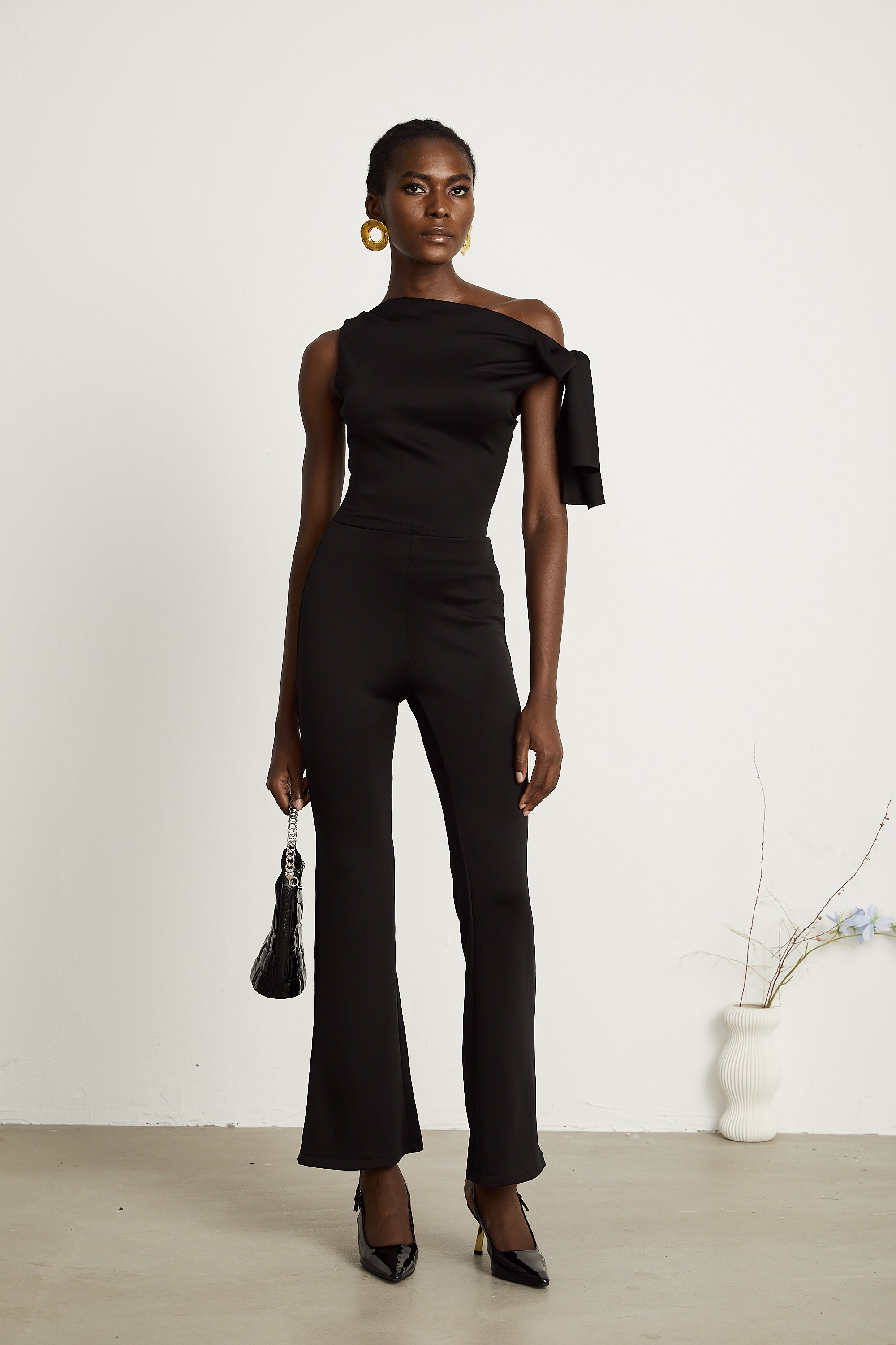 Ensemble coordonné Clotilde : haut et pantalon en maille noire (Vente définitive - États-Unis uniquement)
