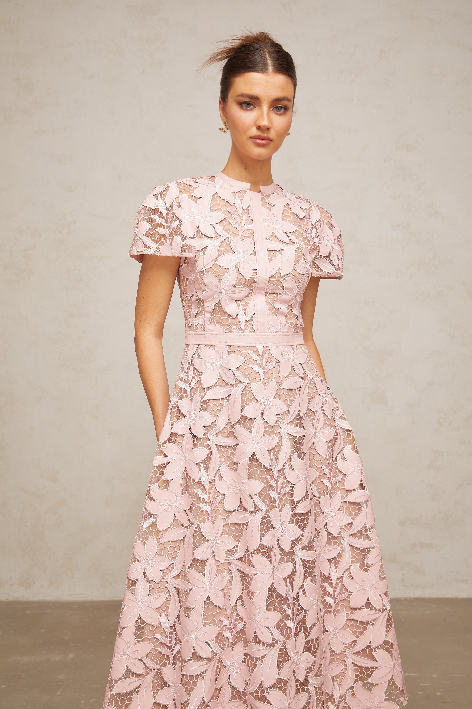 Pink floral laser-cut midi dress with short sleeves and a high neckline